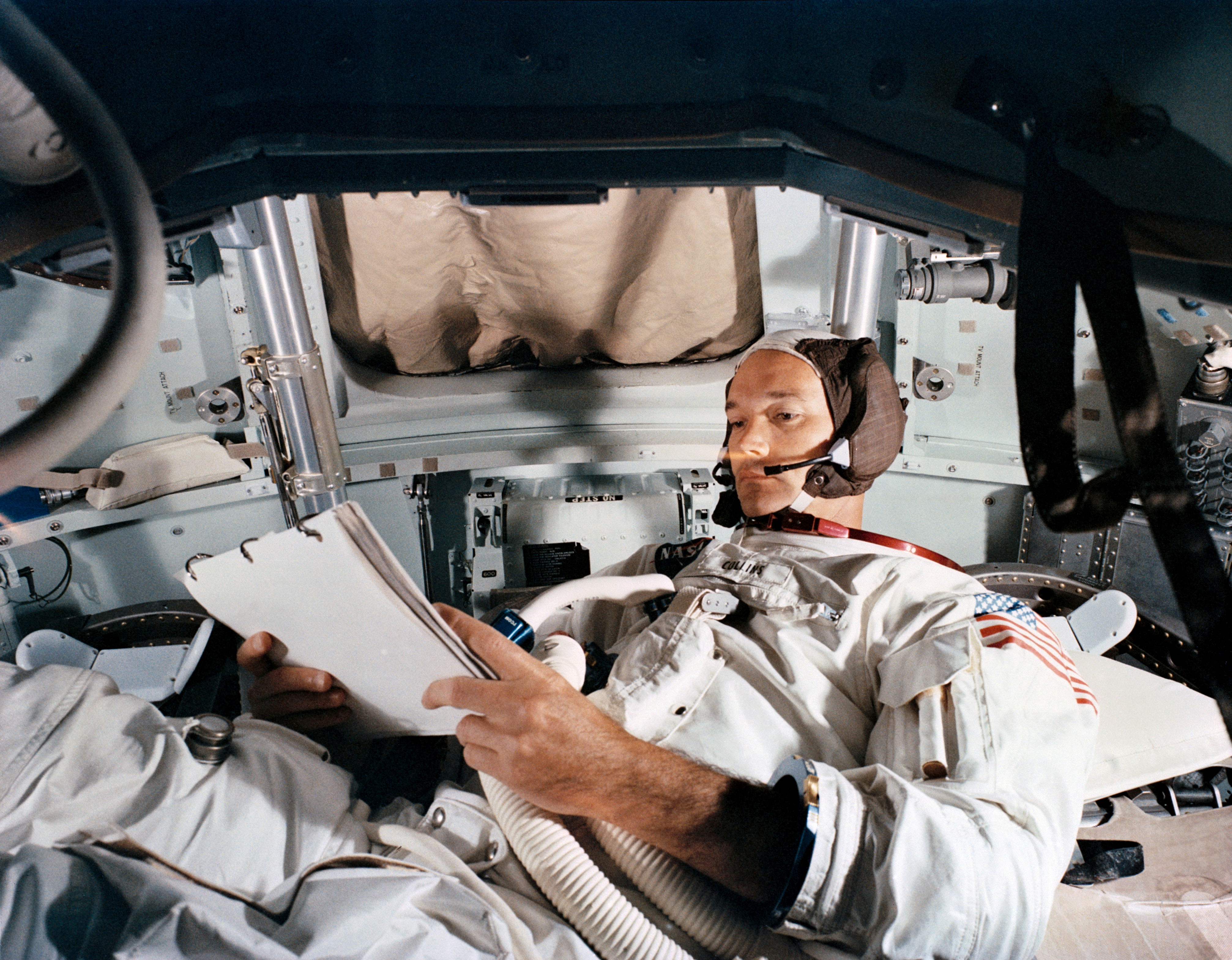 Command Module pilot Michael Collins practices in the CM simulator at Kennedy Space Cente