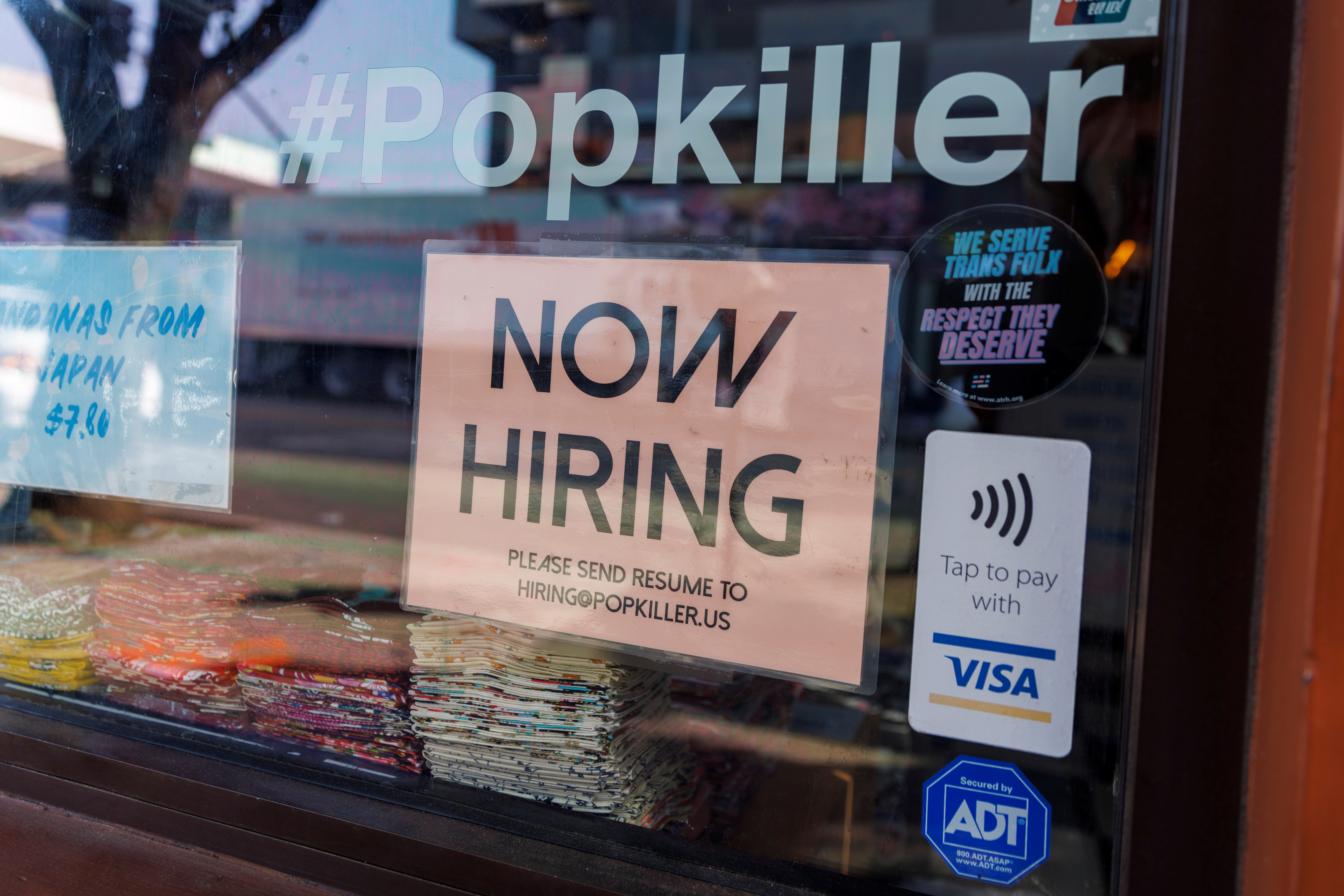 A store advertises for workers in downtown Los Angeles, California, U.S. November, 16, 2021.  REUTERS/Mike Blake