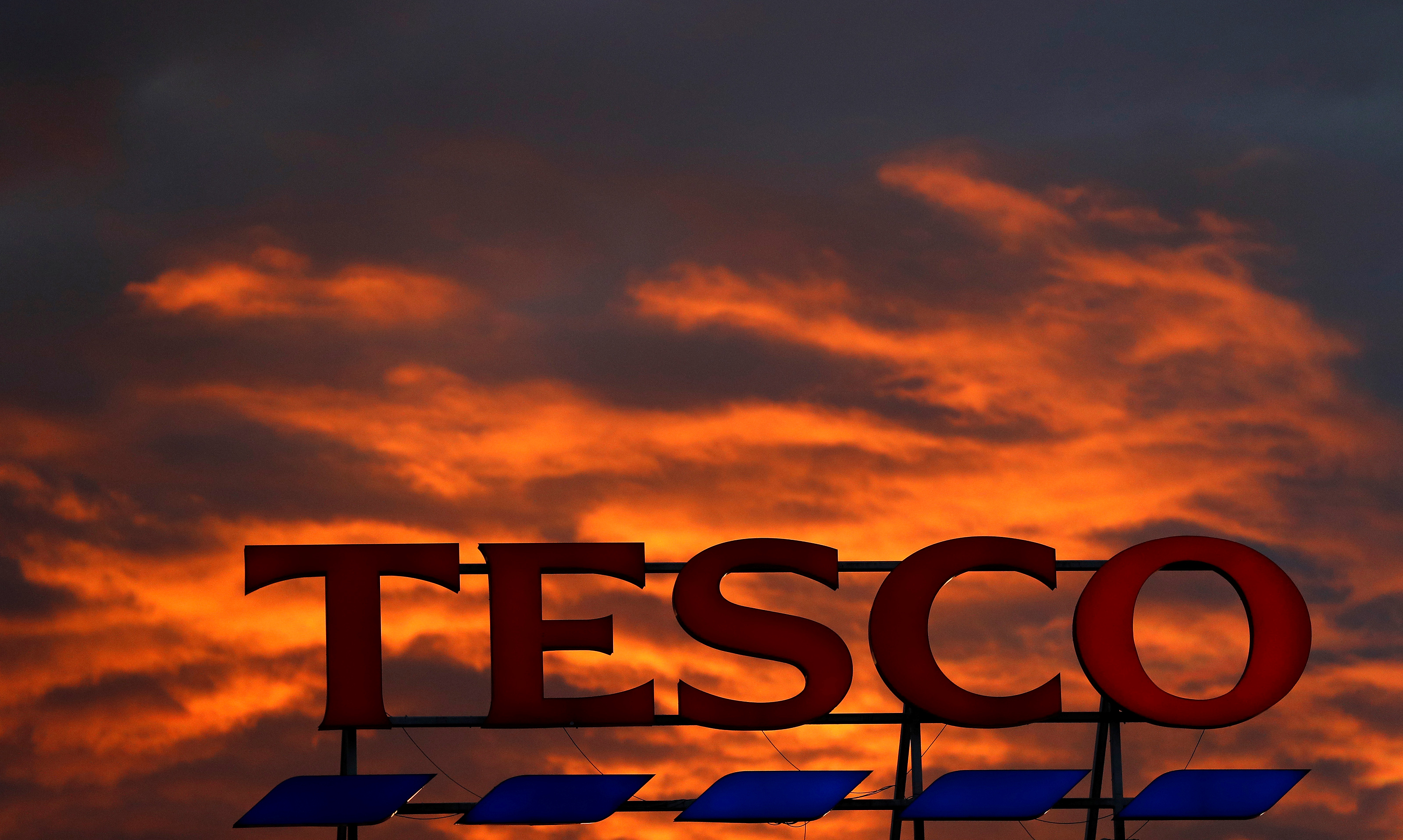 Tesco to cut 300 head office jobs while raising pay for shop workers, Tesco