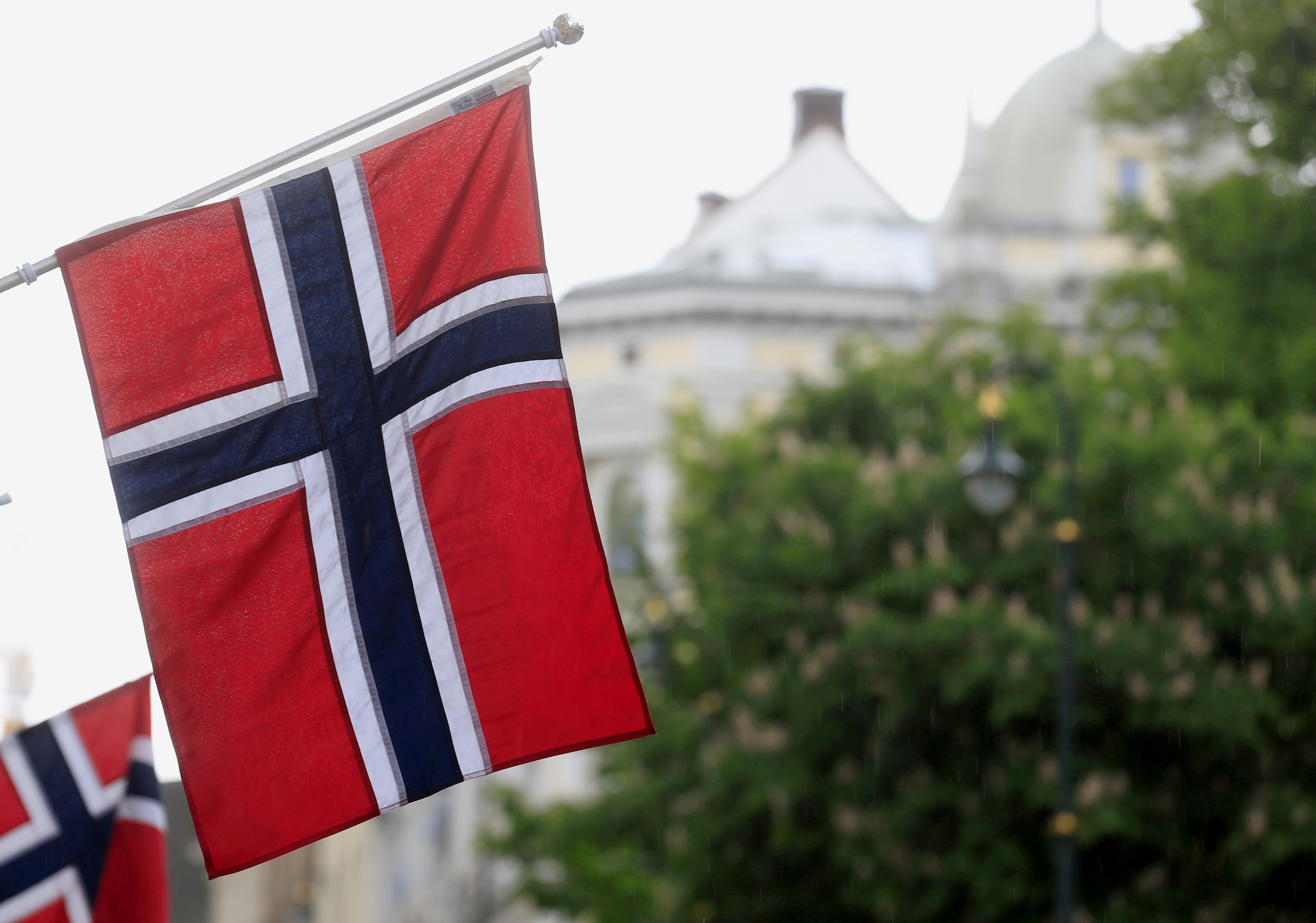 Norwegian flags flutter at Karl Johans street in Oslo, Norway