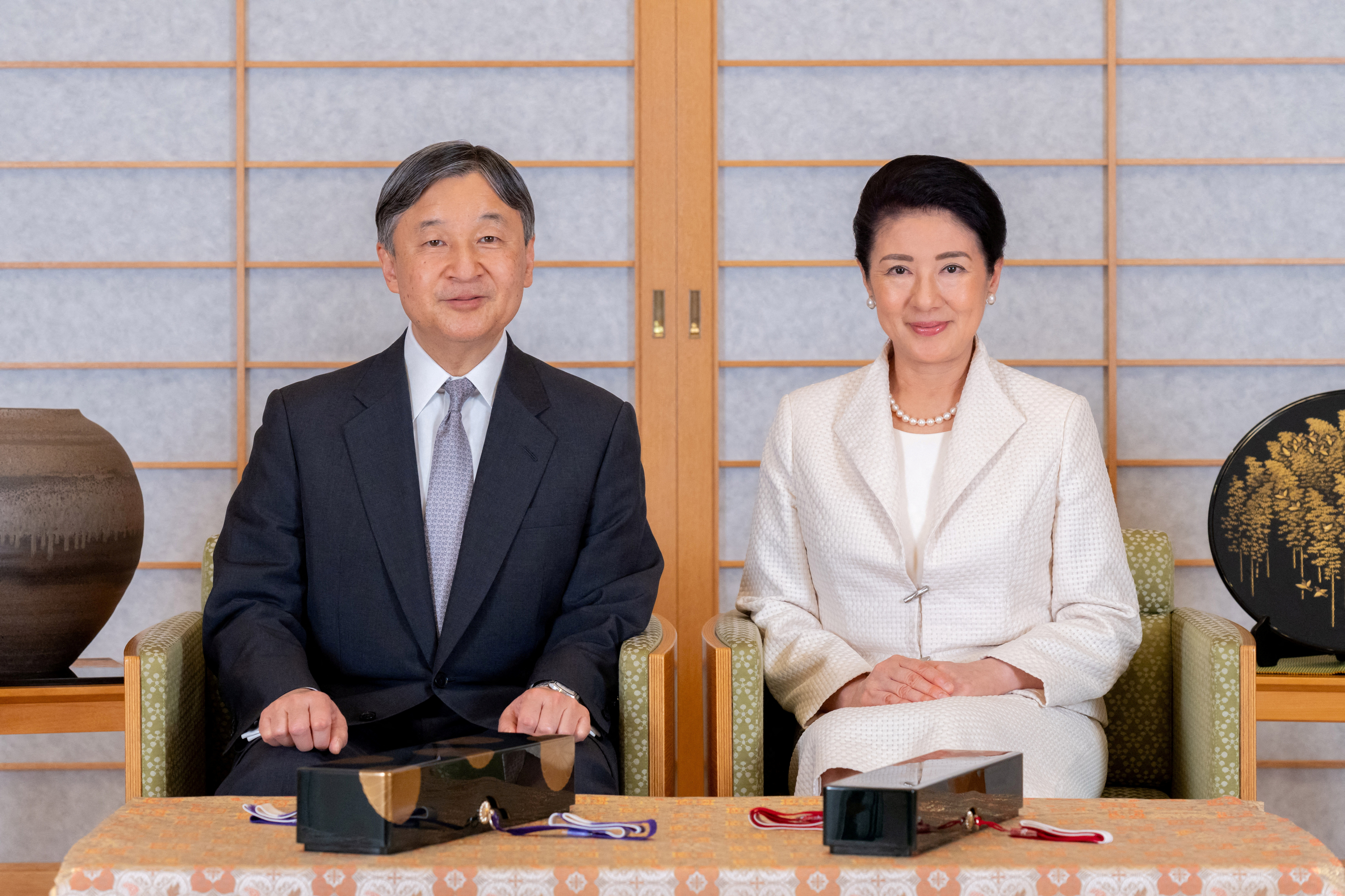 Japan's Emperor Naruhito poses for a photograph with Empress Masako at the Imperial Palace in Tokyo