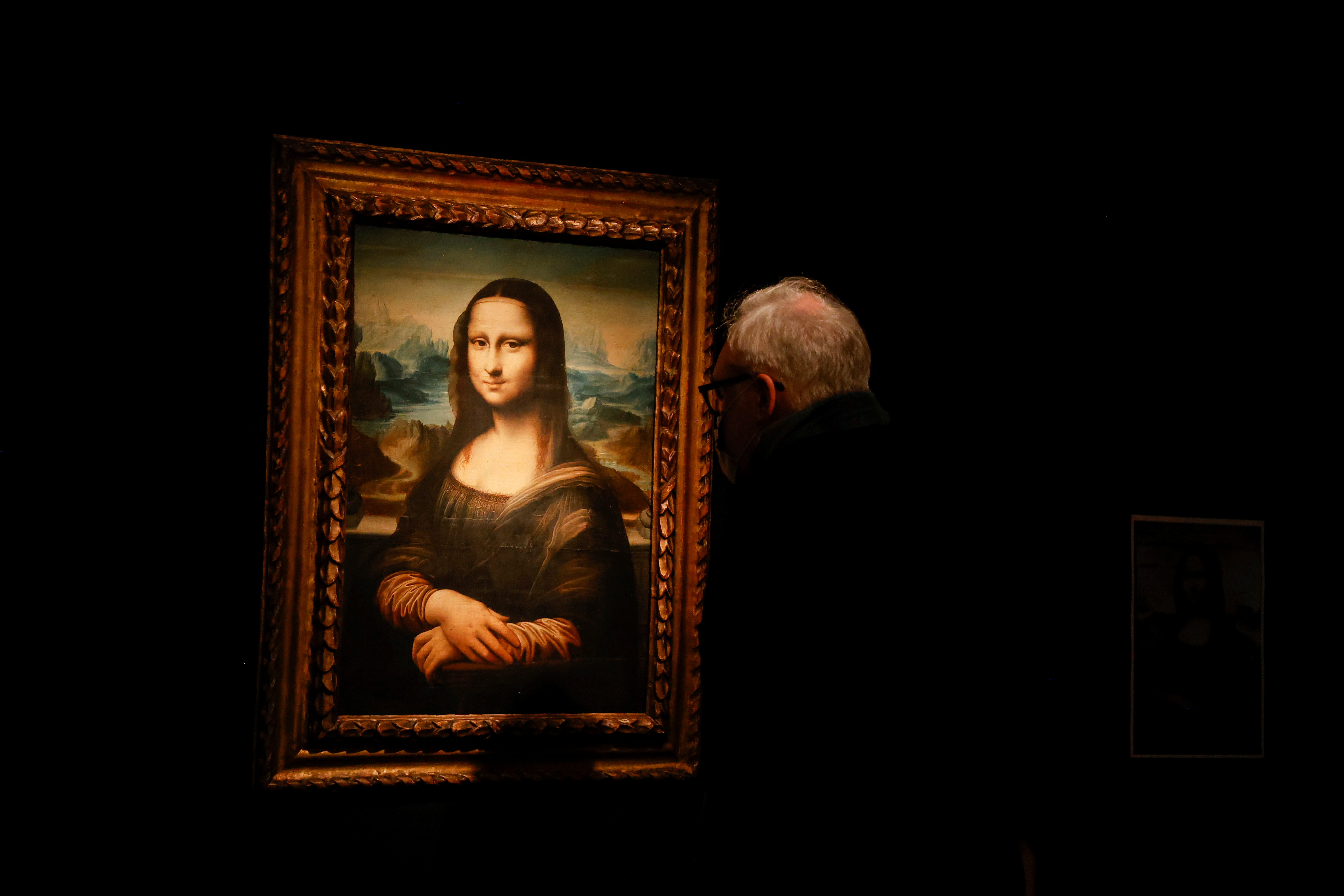 A visitor looks at a copy of the Leonardo da Vinci's Mona Lisa, which will go up for auction on November 9, at the Artcurial auction house in Paris, France, November 5, 2021. REUTERS/Noemie Olive
