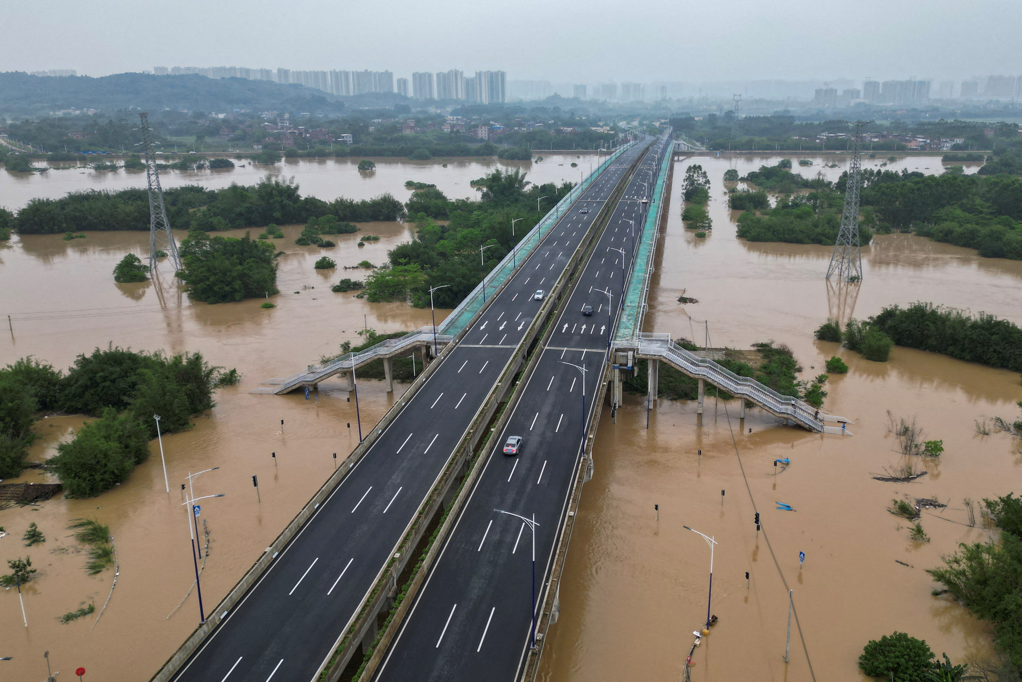 Drone view shows roads submerged in floodwaters following heavy rainfall,in Qingyuan