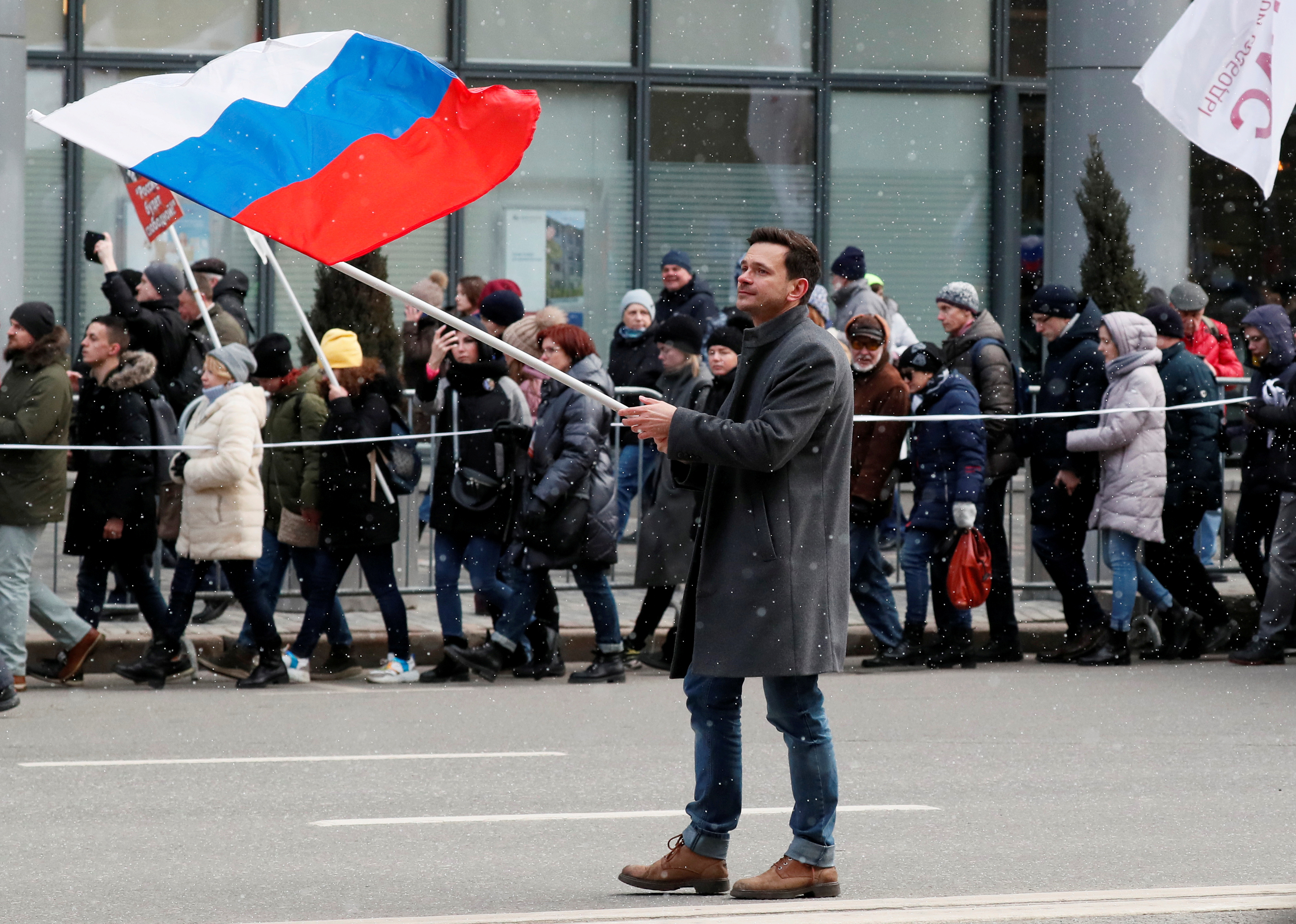 Russian opposition figure Ilya Yashin takes part in a rally to mark the 5th anniversary of opposition politician Boris Nemtsov's murder and to protest against proposed amendments to the country's constitution, in Moscow