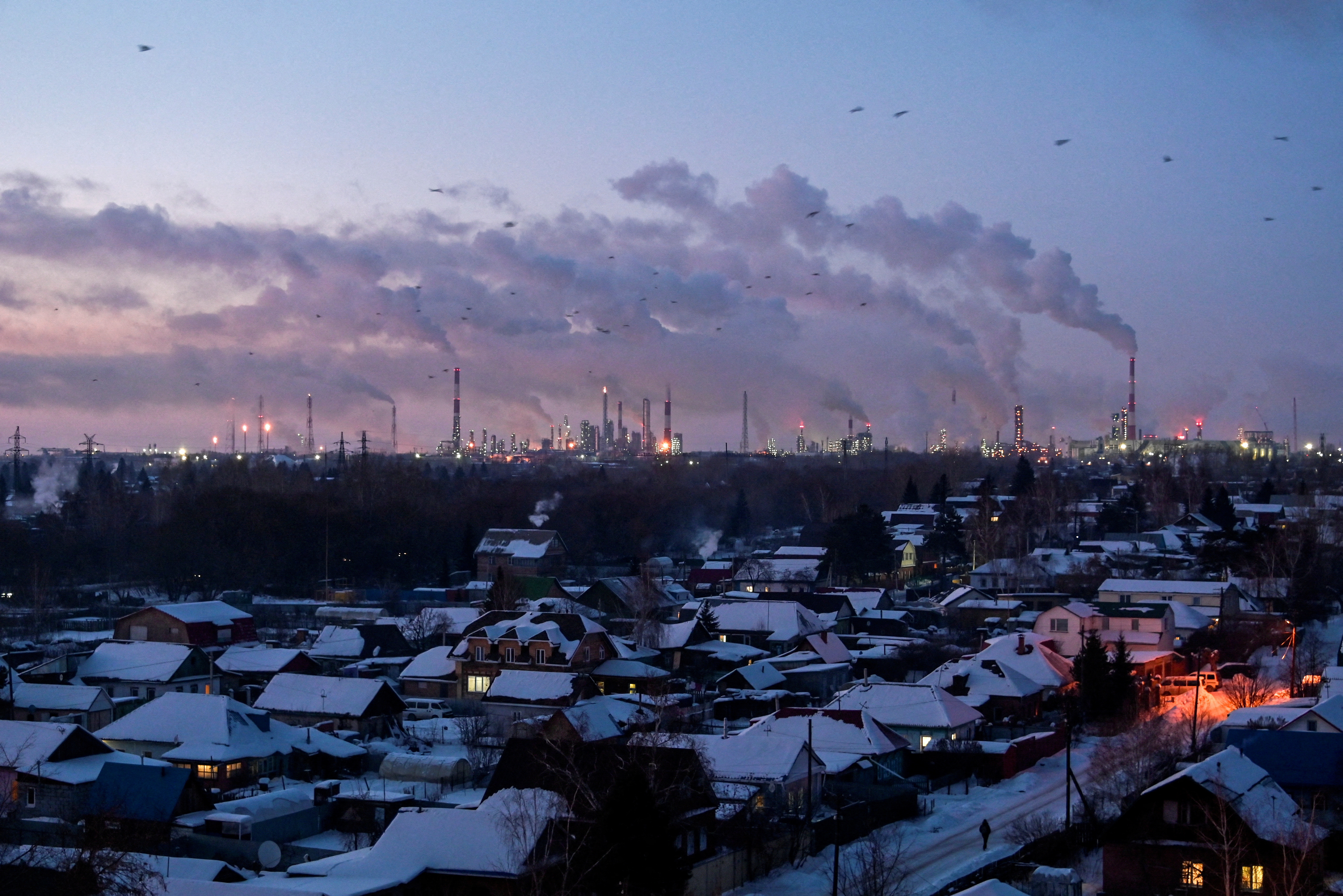 Flue gas and steam rise out of chimneys in Omsk