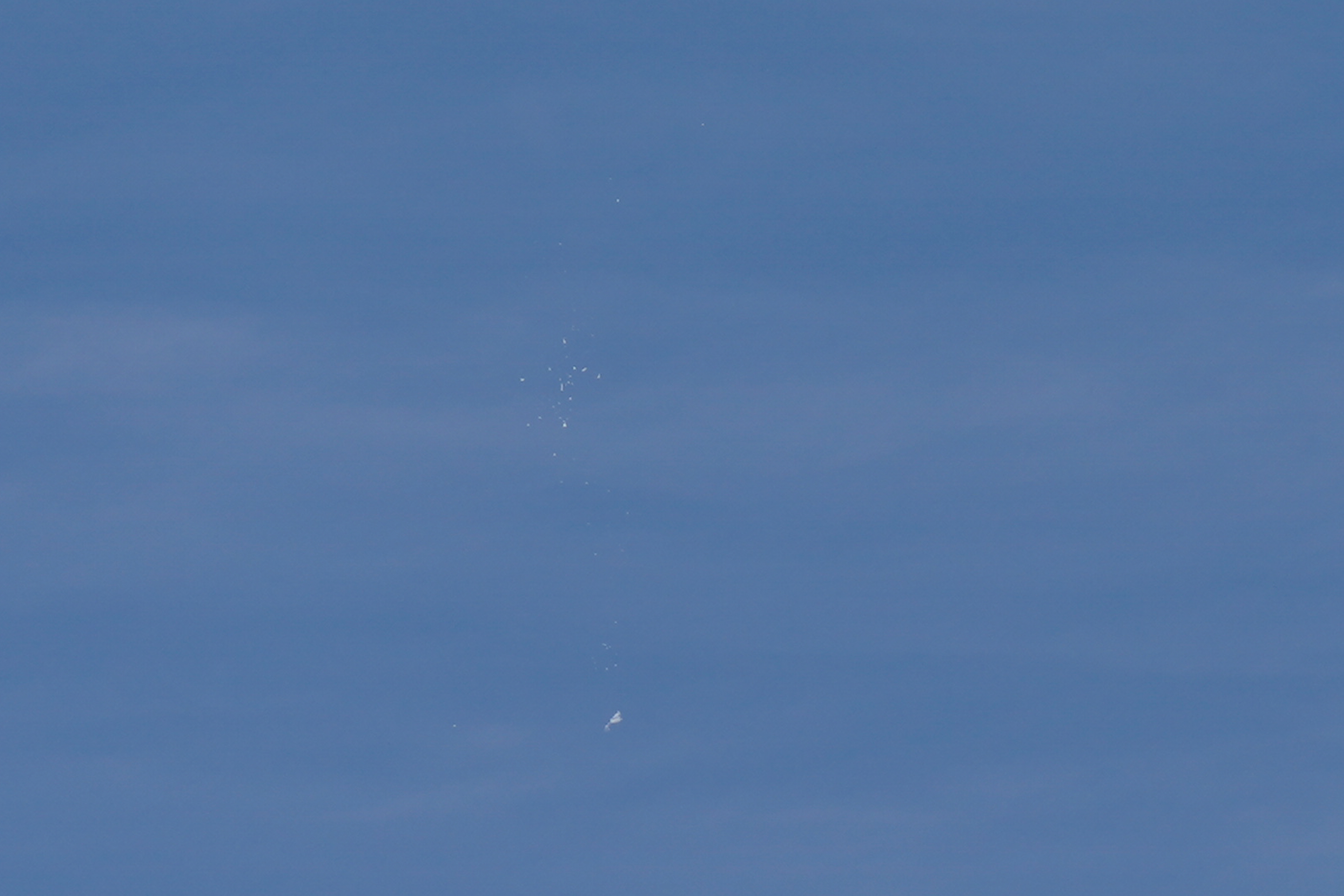 A view of what is believed to be a suspected Chinese spy balloon when it was shot down, seen from Holden Beach