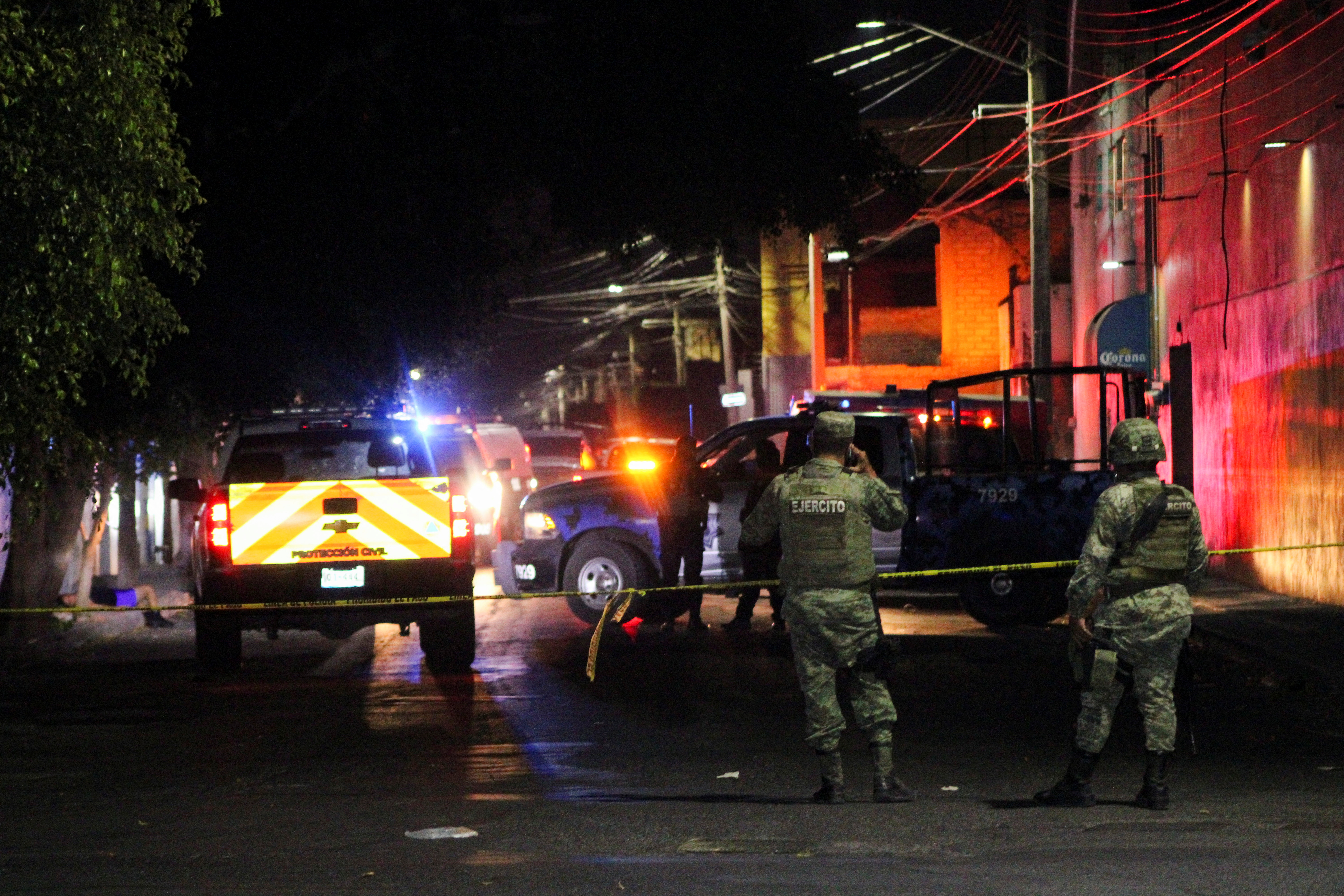 Security forces guard at the scene where gunmen attacked bars and killed people, in Celaya