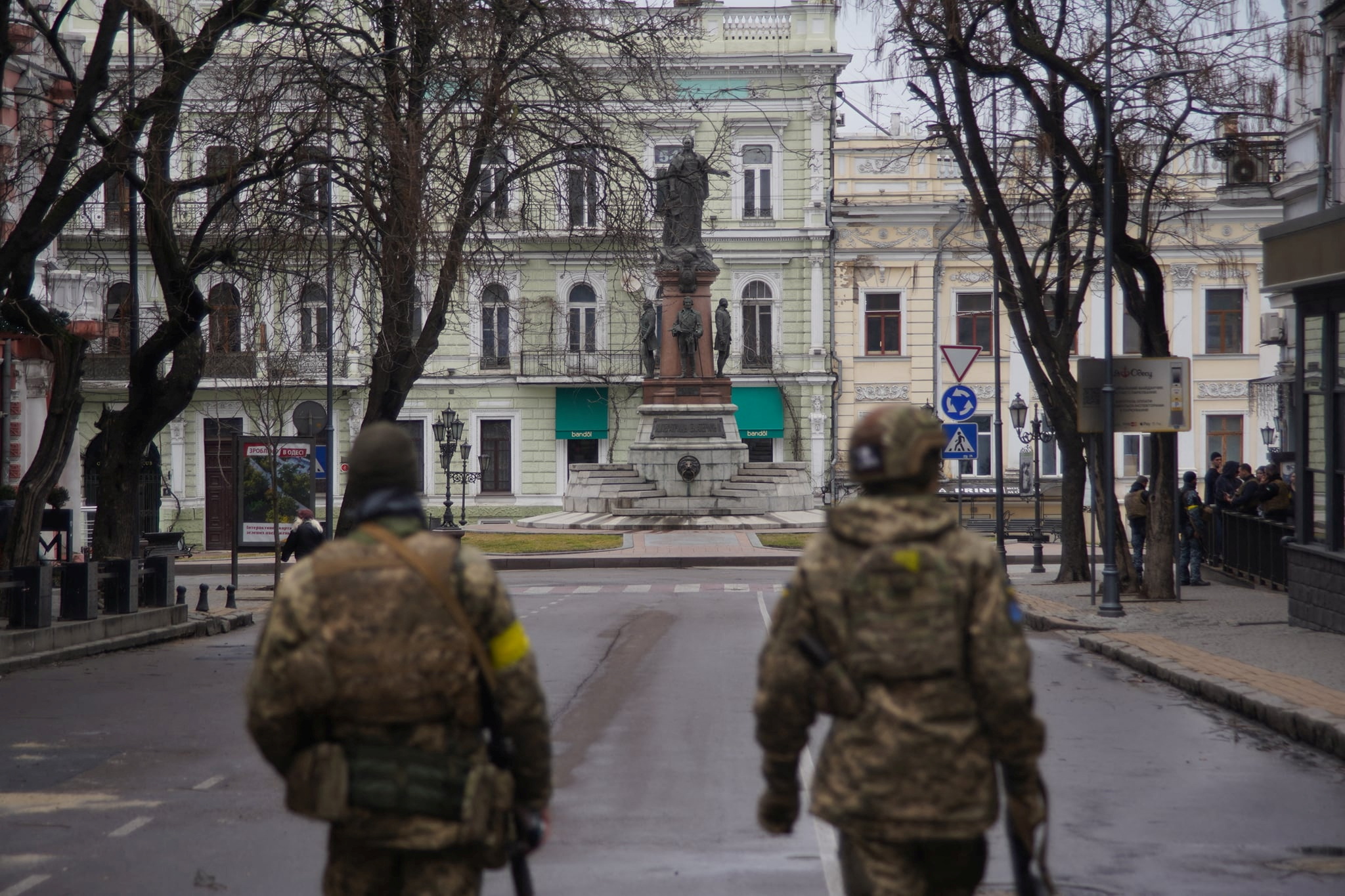 Members of Ukraine's Territorial Defence Forces patrol a street in Odessa