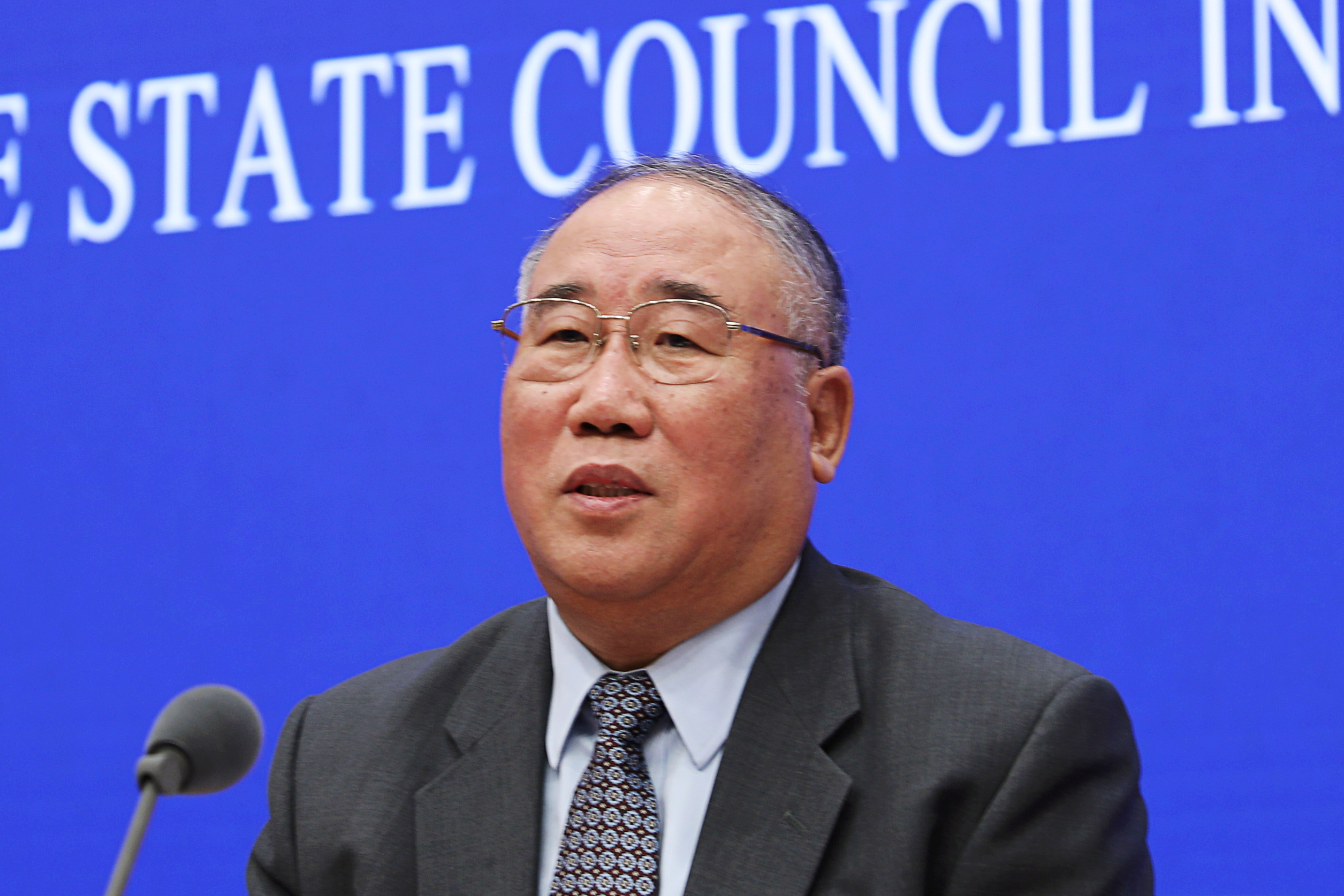 FILE PHOTO - Xie Zhenhua, China's special representative for Climate Change Affair, speaks during a press conference in Beijing, China November 26, 2018. REUTERS/Stringer/File Picture 
