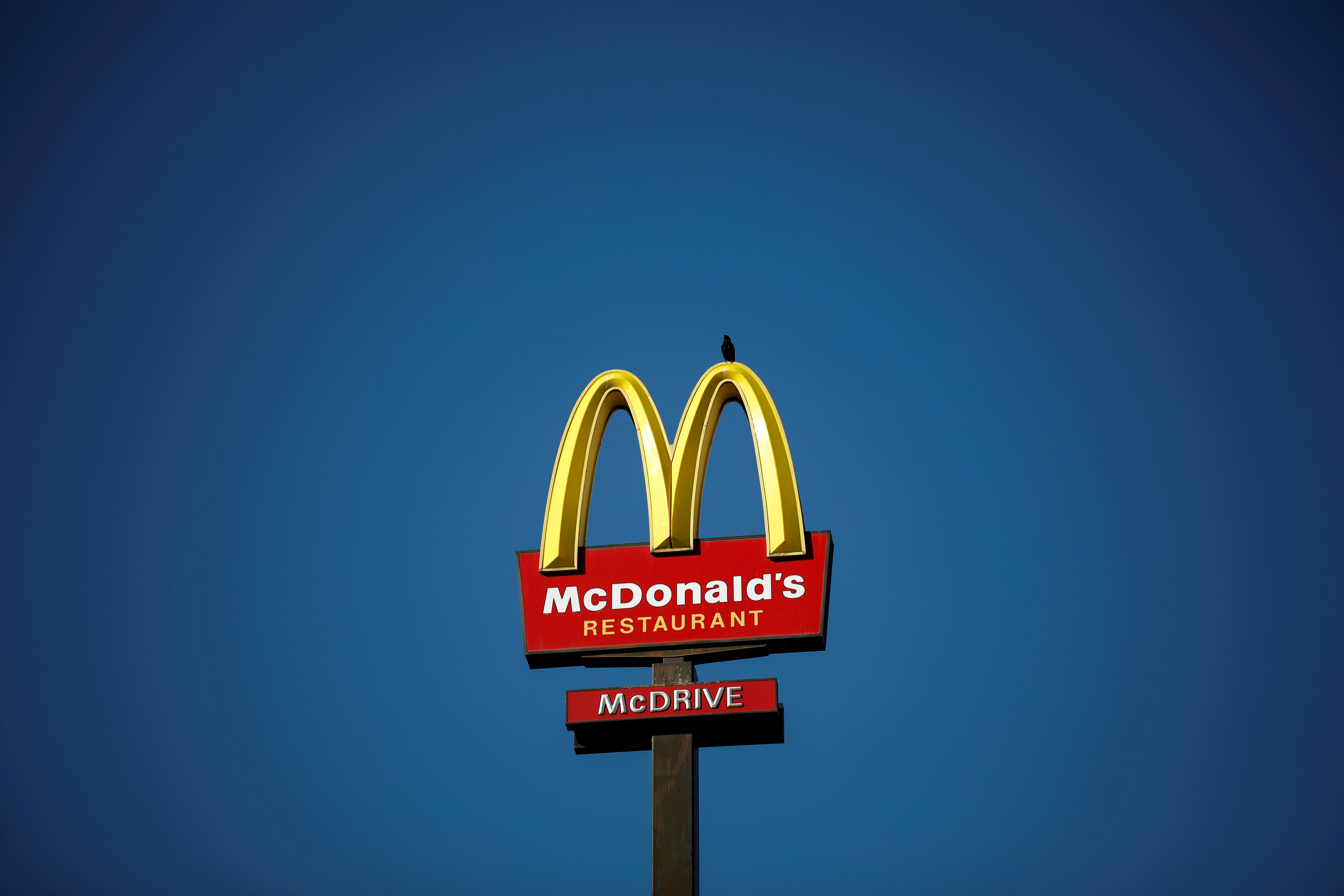 The McDonald's company logo stands on a sign outside a restaurant in Bretigny-sur-Orge, near Paris, France, July 30, 2020. REUTERS/Benoit Tessier