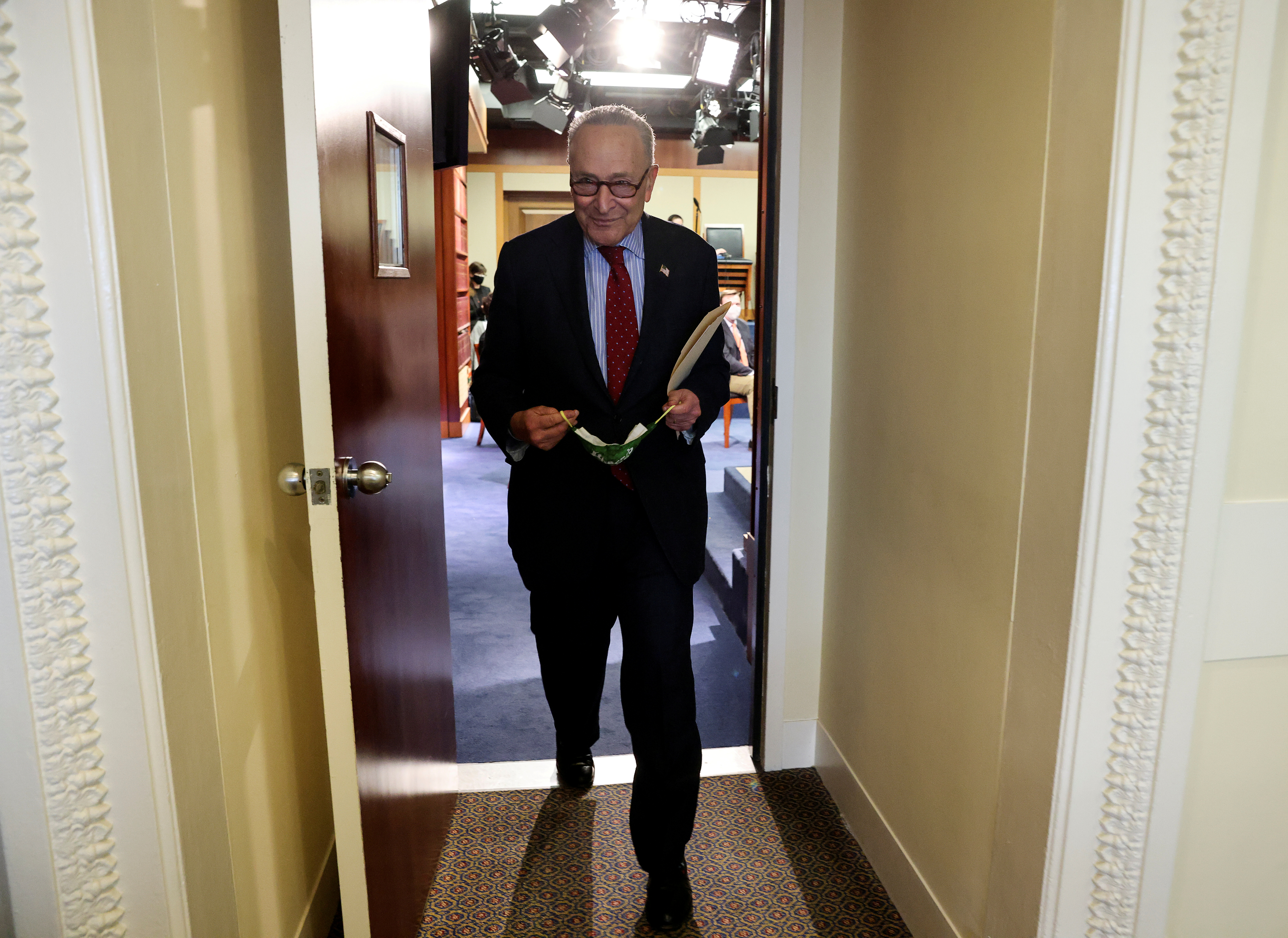 U.S. Senate Majority Leader Chuck Schumer (D-NY) departs after holding a news conference at the U.S. Capitol in Washington, U.S., March 25, 2021. REUTERS/Jonathan Ernst/Pool/File Photo