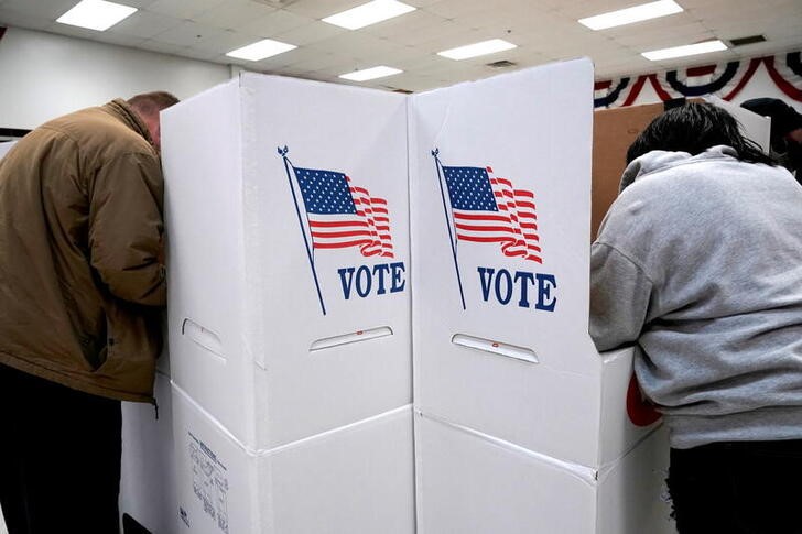 Voters stand at voting booths during early voting at the Oklahoma Election Board in Oklahoma City