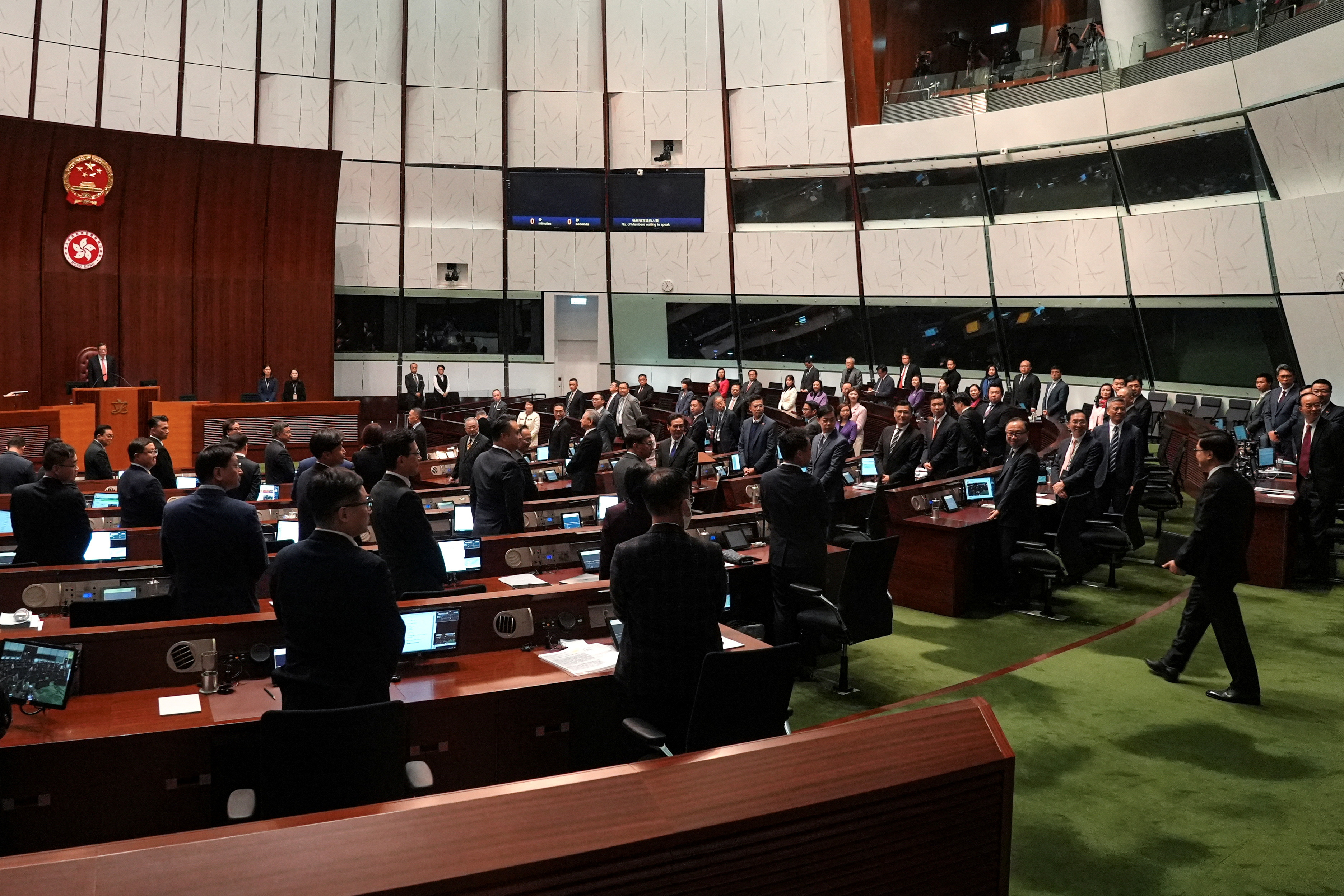 Hong Kong Chief Executive John Lee enters the chamber after the Basic Law Article 23 is passed