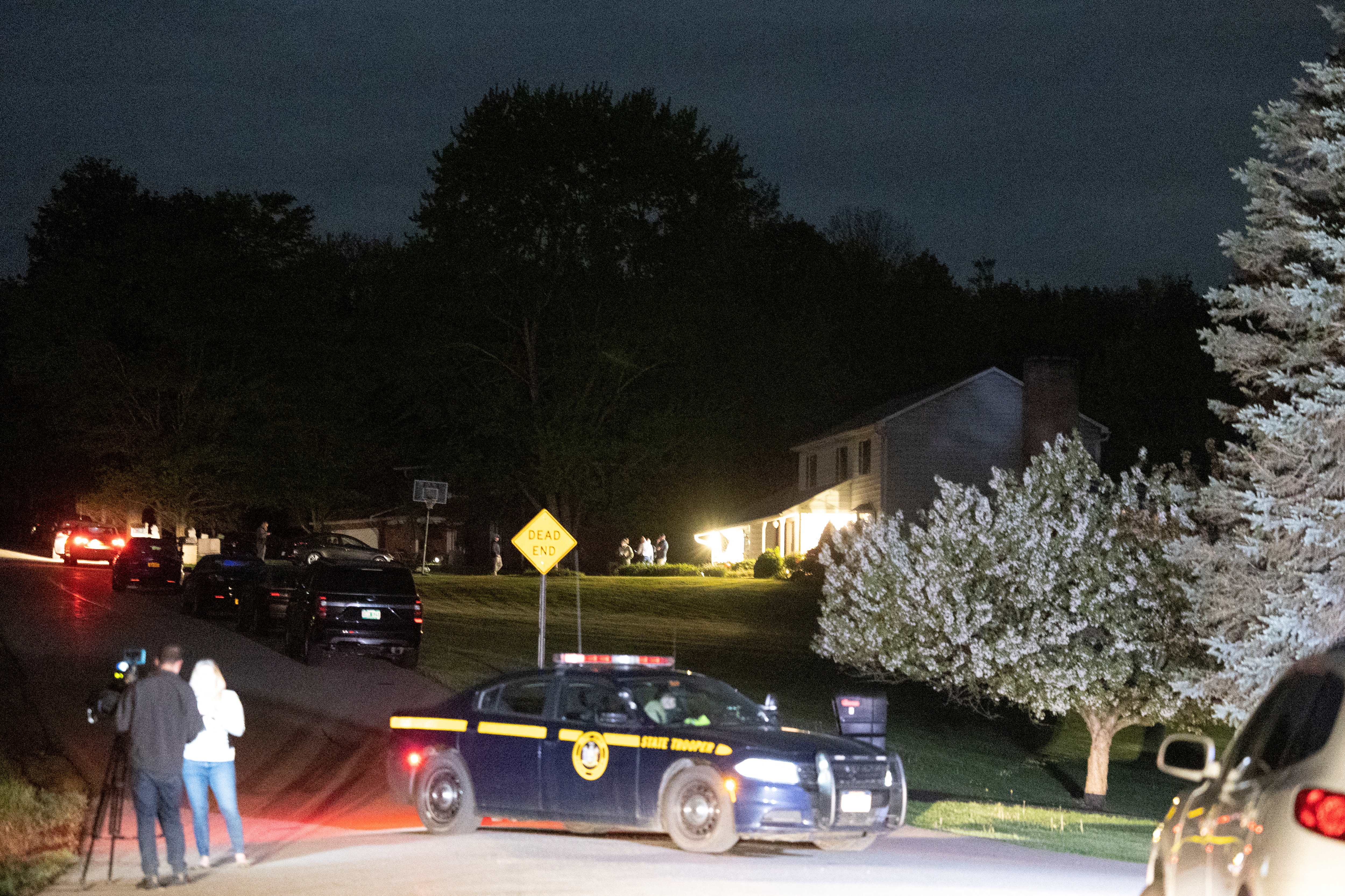 Law enforcement personnel are seen at the home of Buffalo supermarket shooting suspect