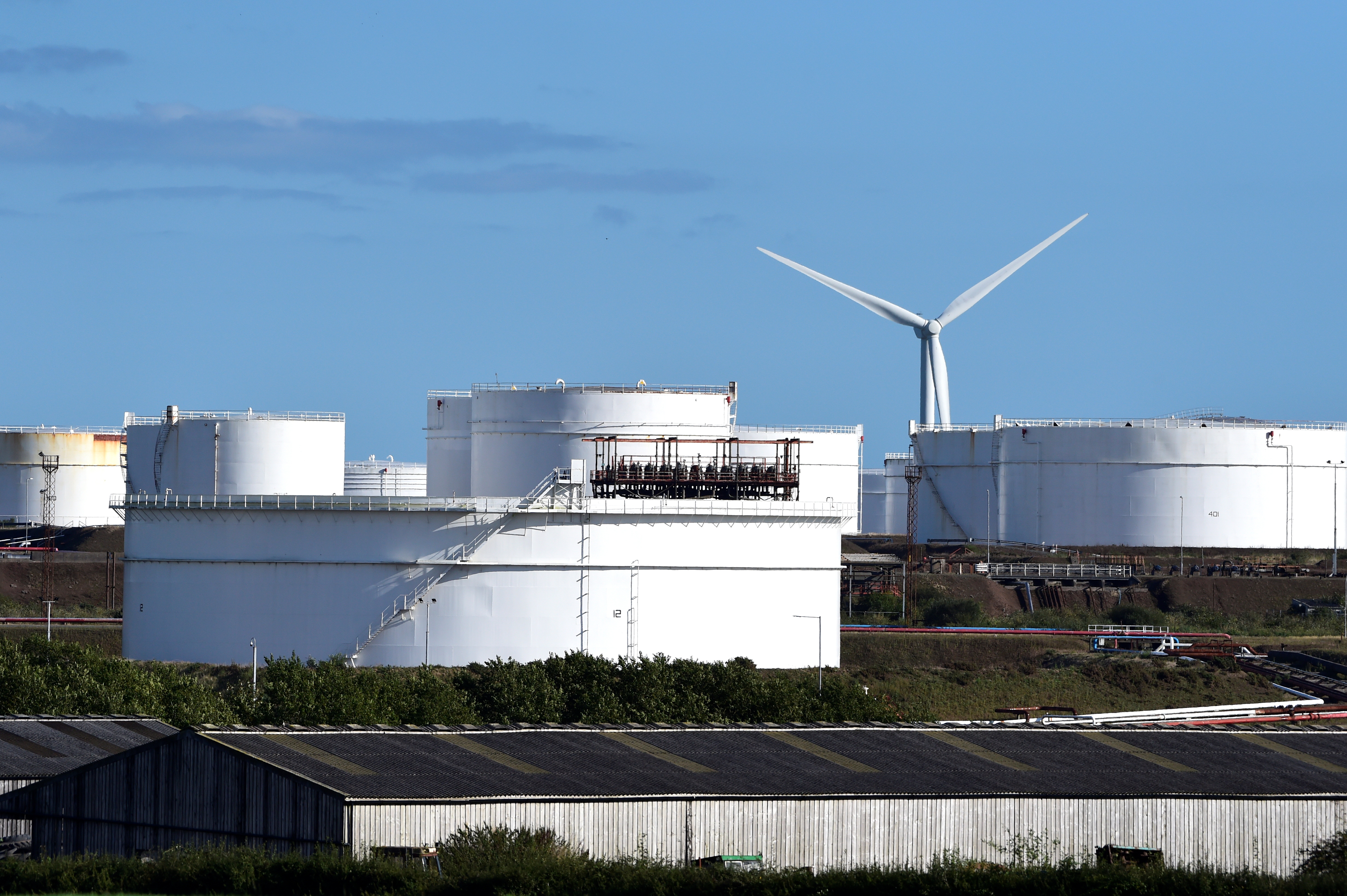Storage tanks are seen at the Dragon Liquefied Natural Gas (LNG) facility at Waterston, Milford Haven, Pembrokeshire, Wales, Britain, September 20, 2021. REUTERS/Rebecca Naden