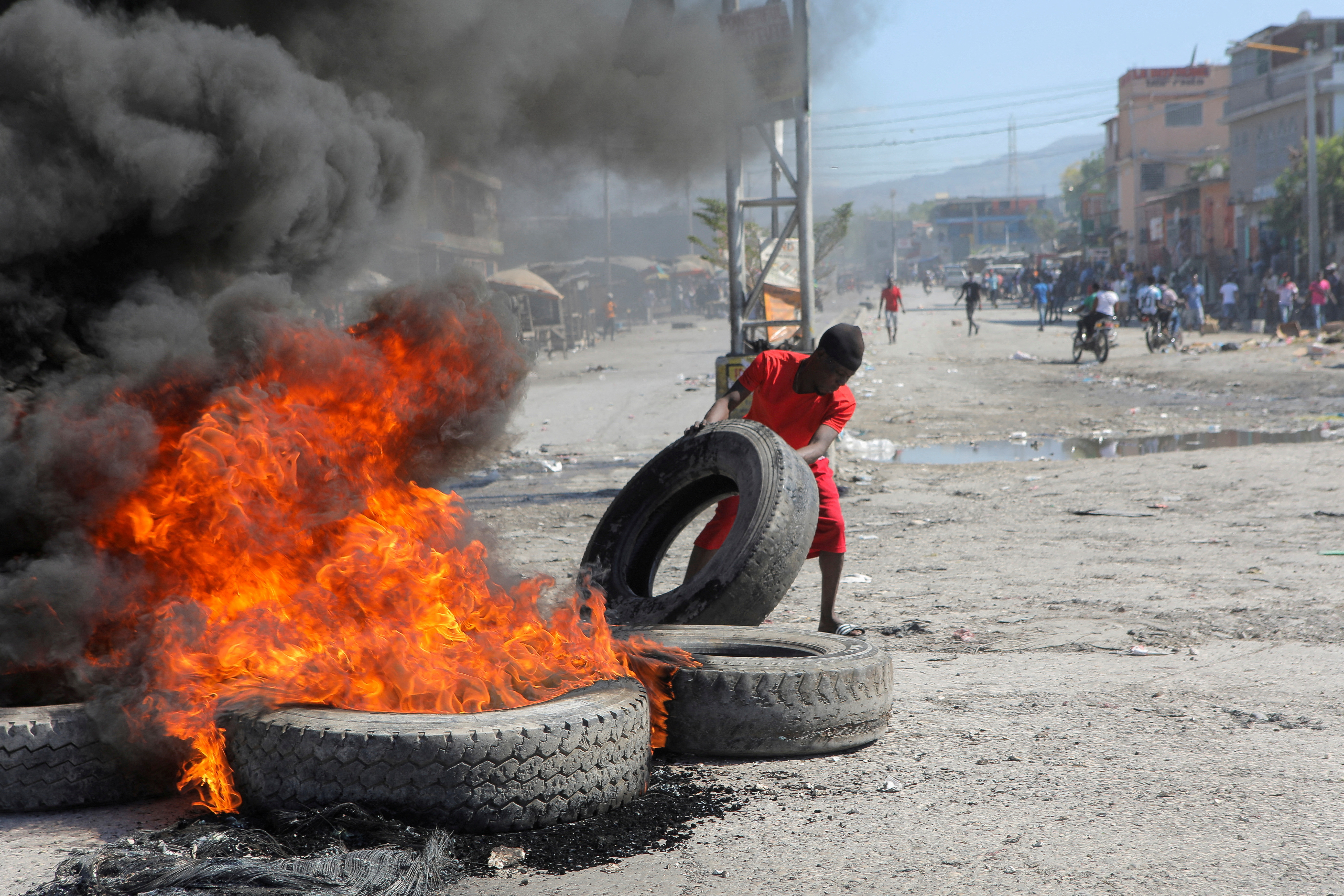 Demonstrators protest the recent killings of police officers by armed gangs, in Port-au-Prince