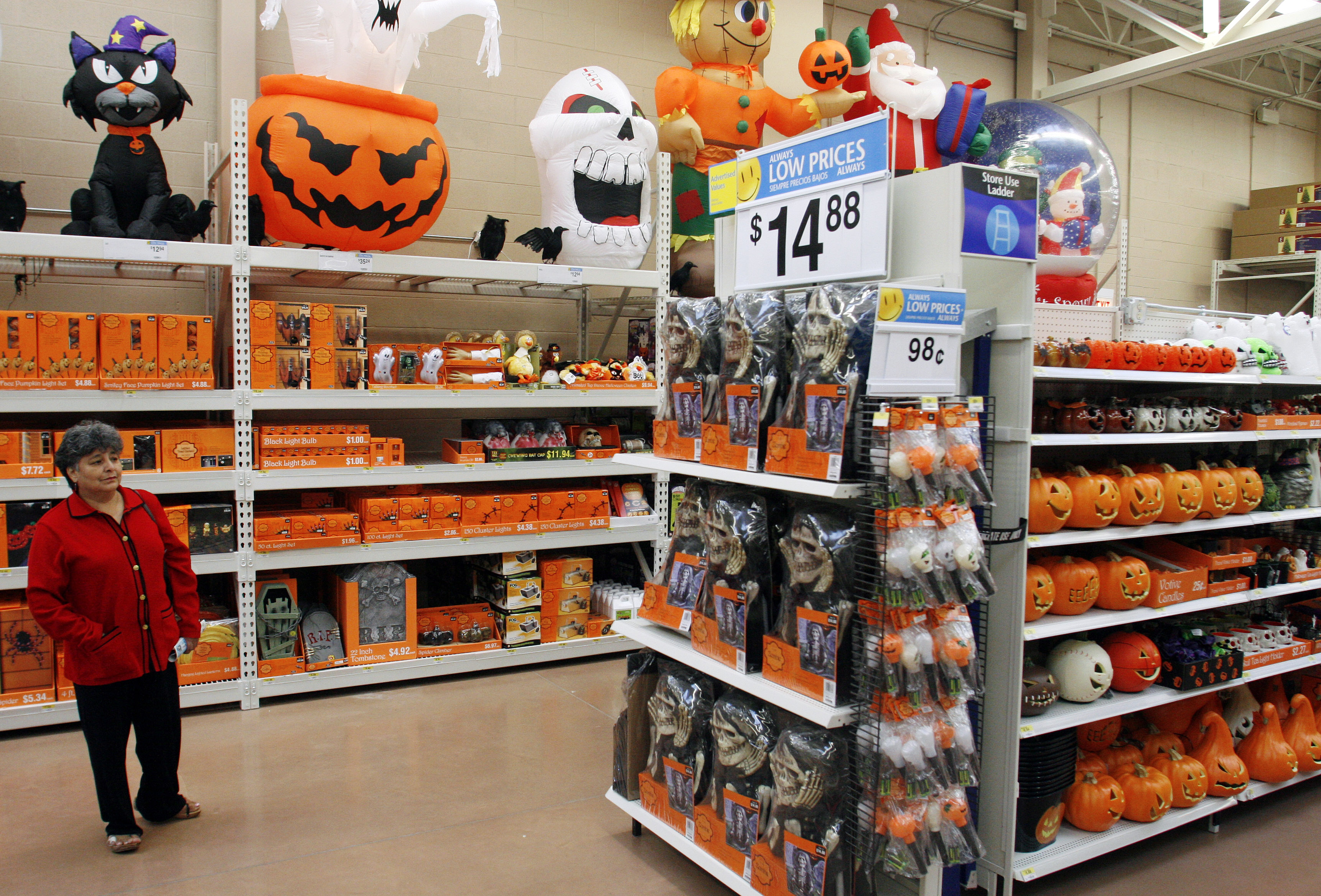 Avilia Palenca looks at Halloween merchandise at the new 142,000 square foot Wal-Mart during the grand opening