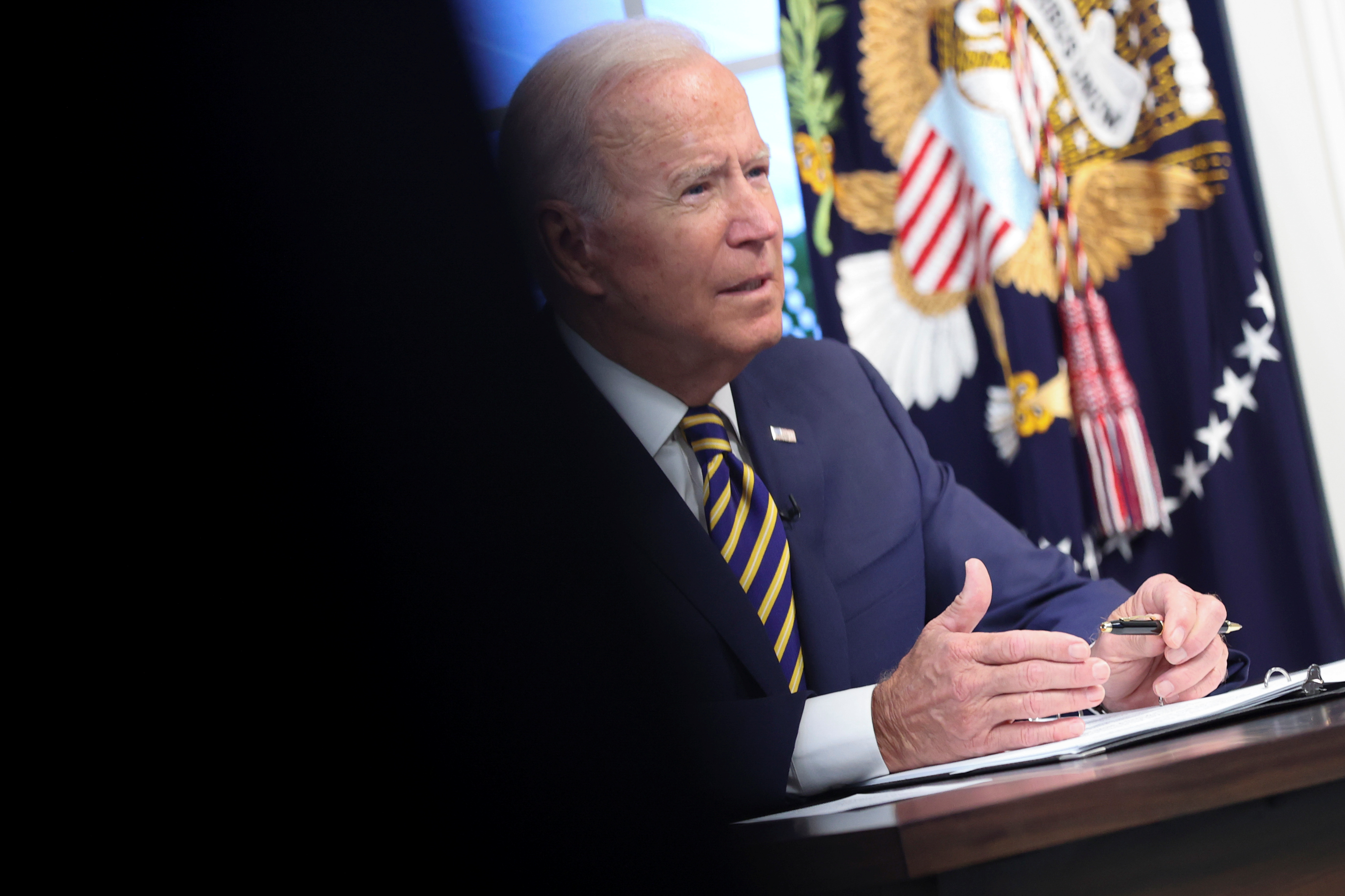 U.S. President Biden participates in a meeting of MEF on climate change, from an auditorium at the White House in Washington