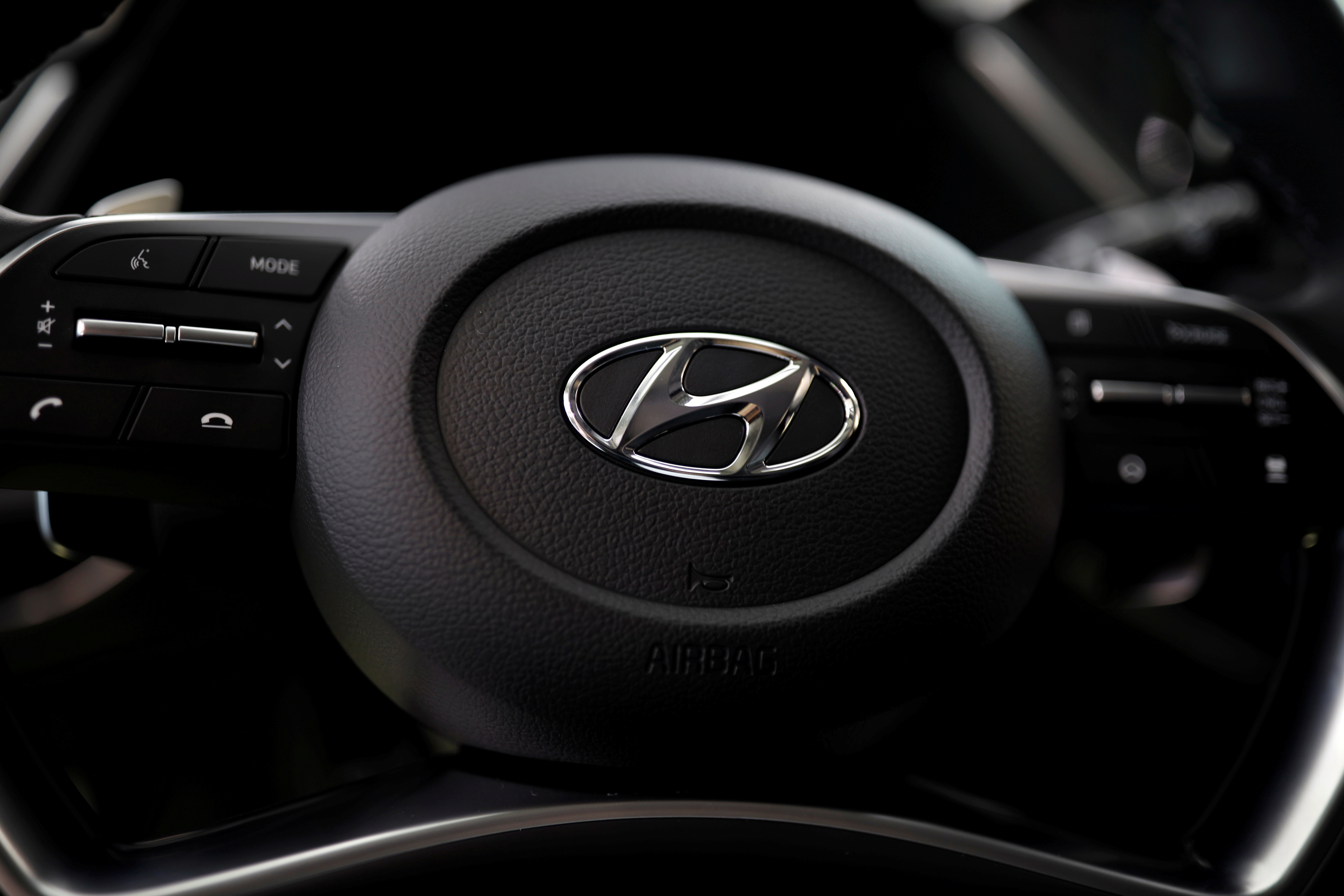 The logo of Hyundai Motors is seen on a steering wheel on display at the company's headquarters in Seoul