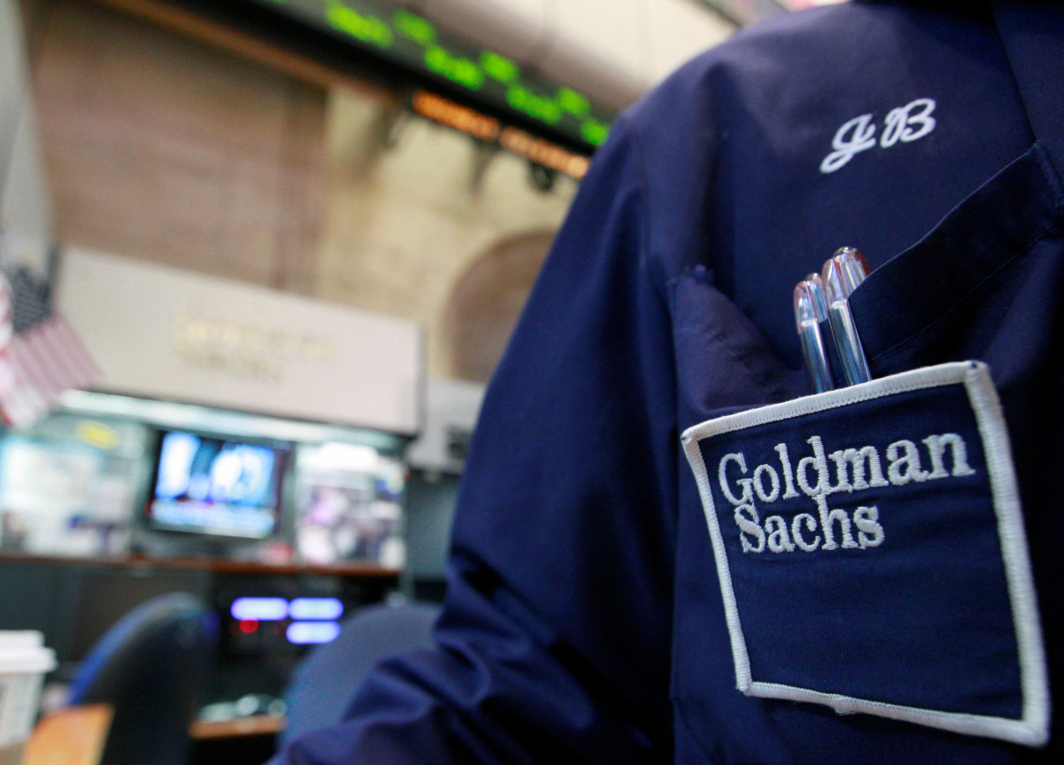 A trader works at a Goldman Sachs booth on the floor of the New York Stock Exchange