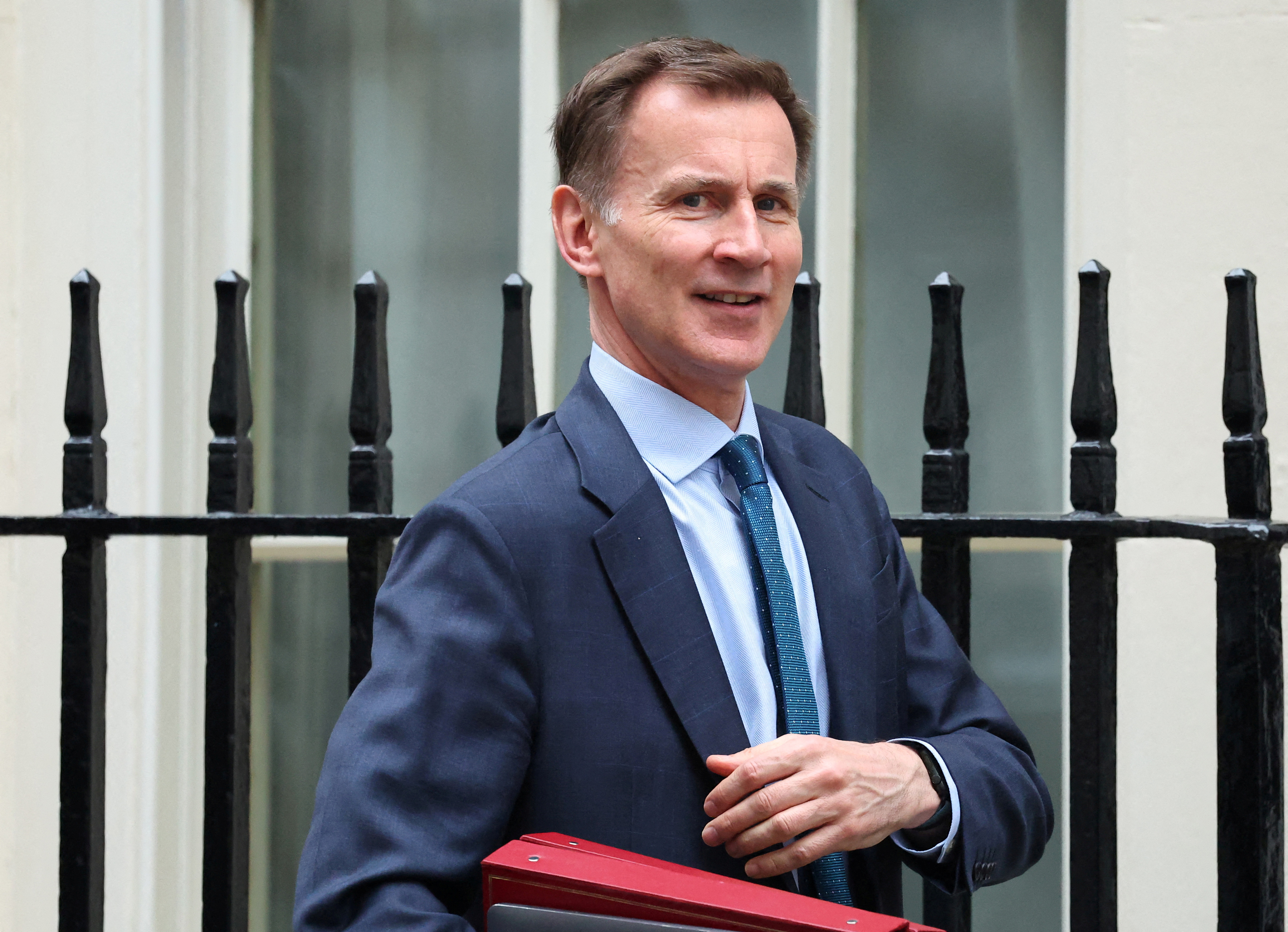 British Finance Minister Hunt leaves Downing Street in London