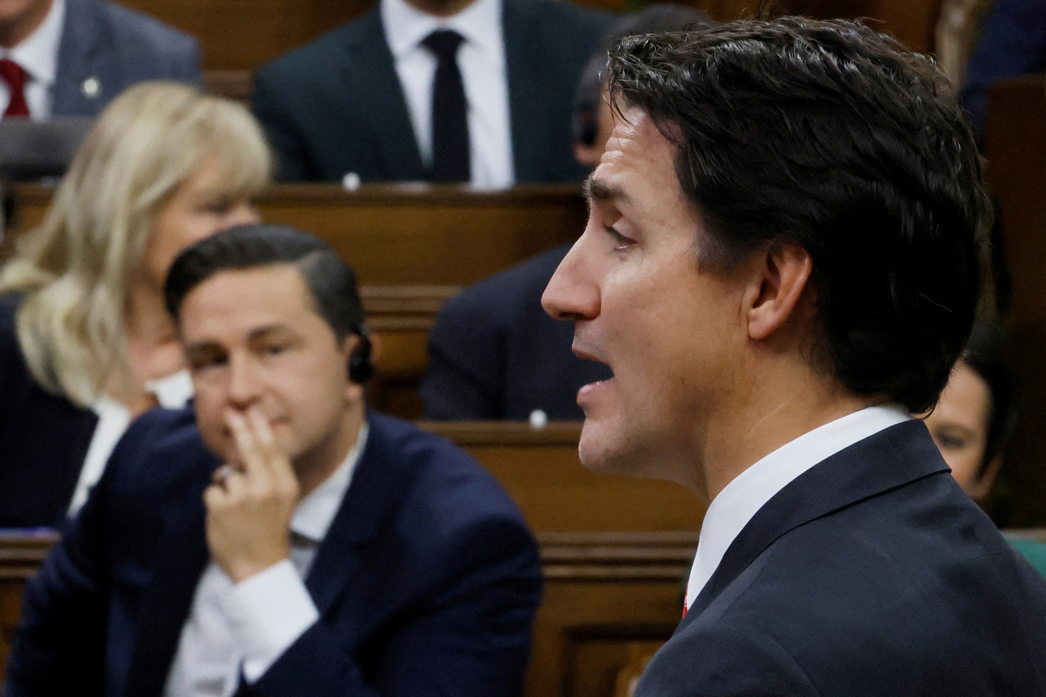 Canada's Prime Minister Justin Trudeau speaks as Conservative Party of Canada leader Pierre Poilievre listens during Question Period in the House of Commons on Parliament Hill in Ottawa
