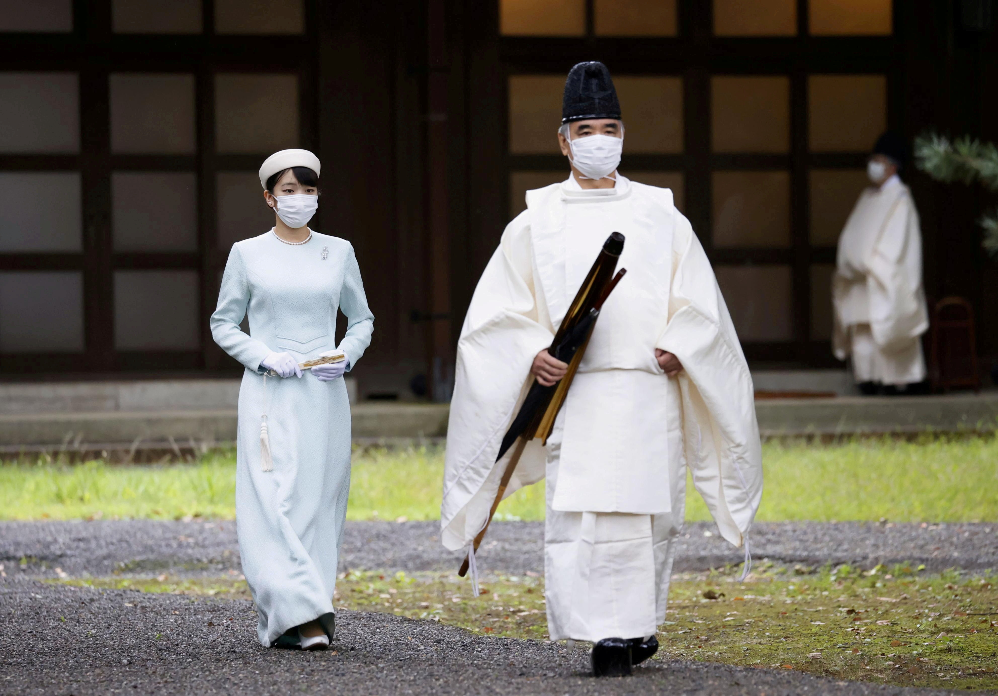 Japan's Princess Mako, the daughter of Crown Prince Akishino and Crown Princess Kiko, walks towards the Three Palace Sanctuaries to pray ahead of her marriage at the Imperial Palace in Tokyo, Japan October 19, 2021, in this photo taken by Kyodo. Mandatory credit Kyodo/via REUTERS  