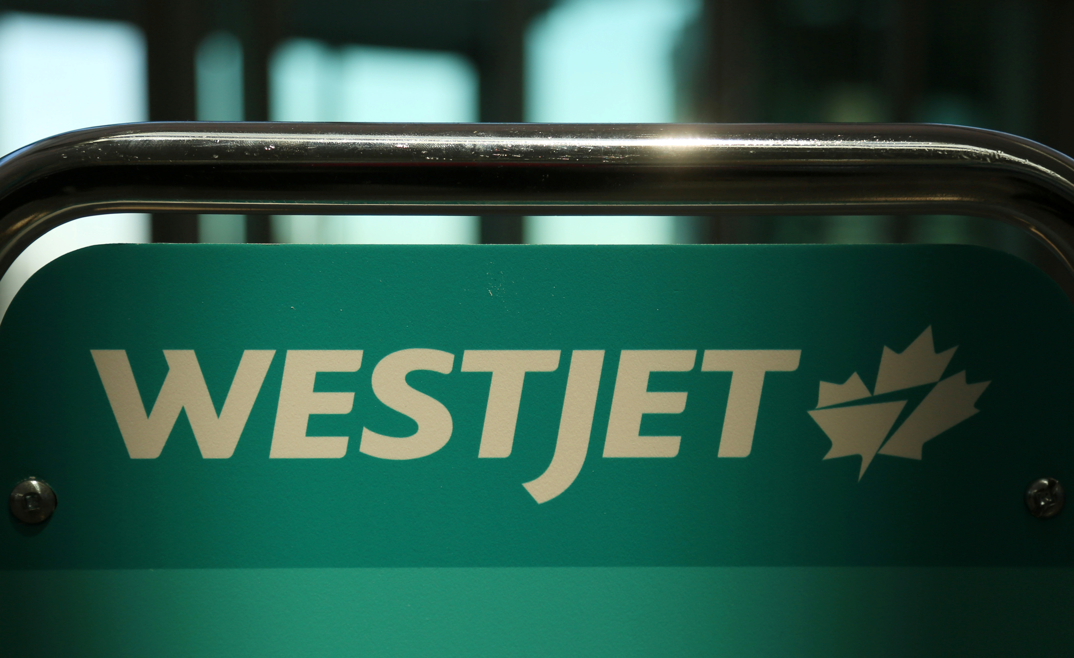 WestJet airline signage is pictured at Vancouver's international airport in Richmond,