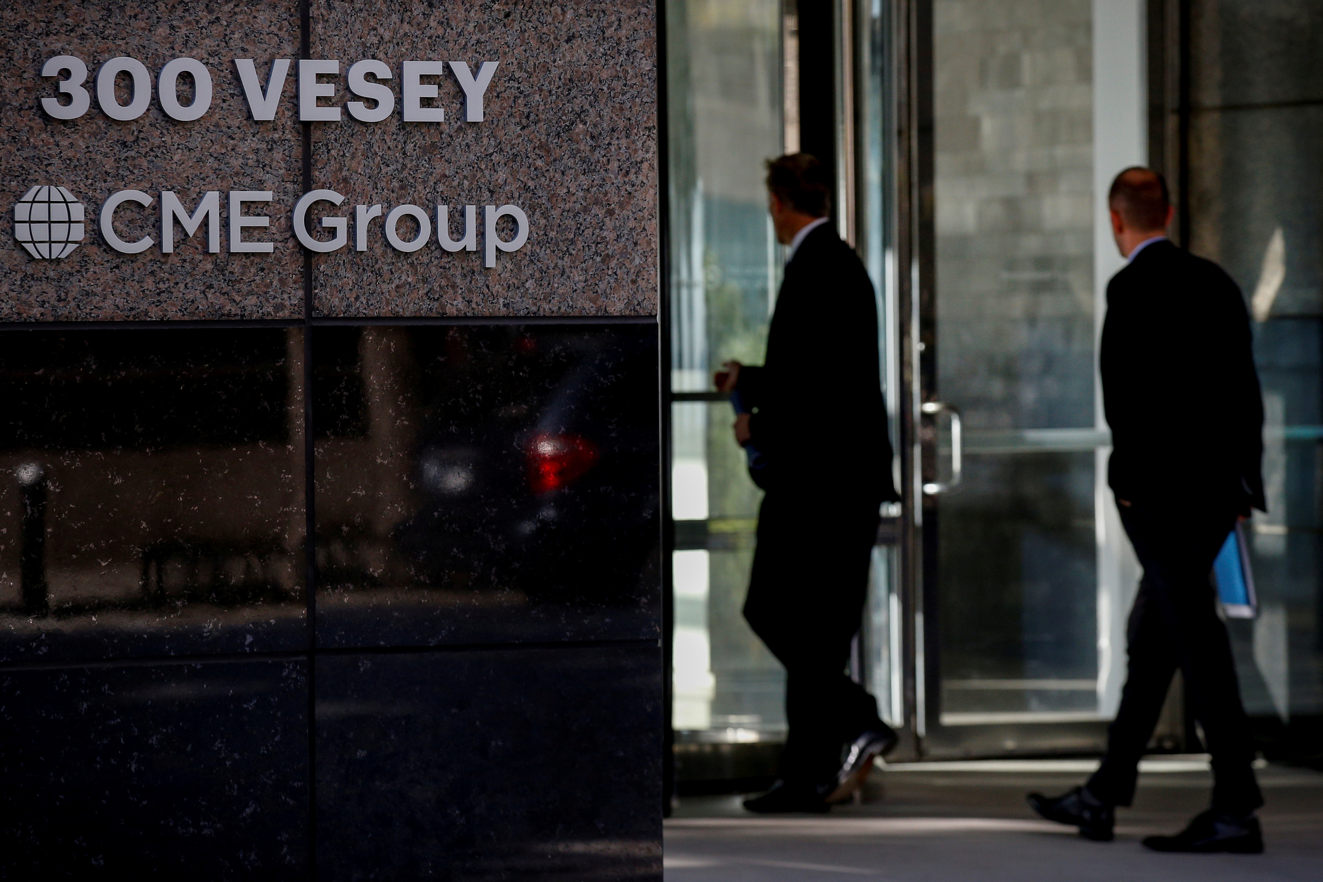 Men enter the CME Group offices in New York