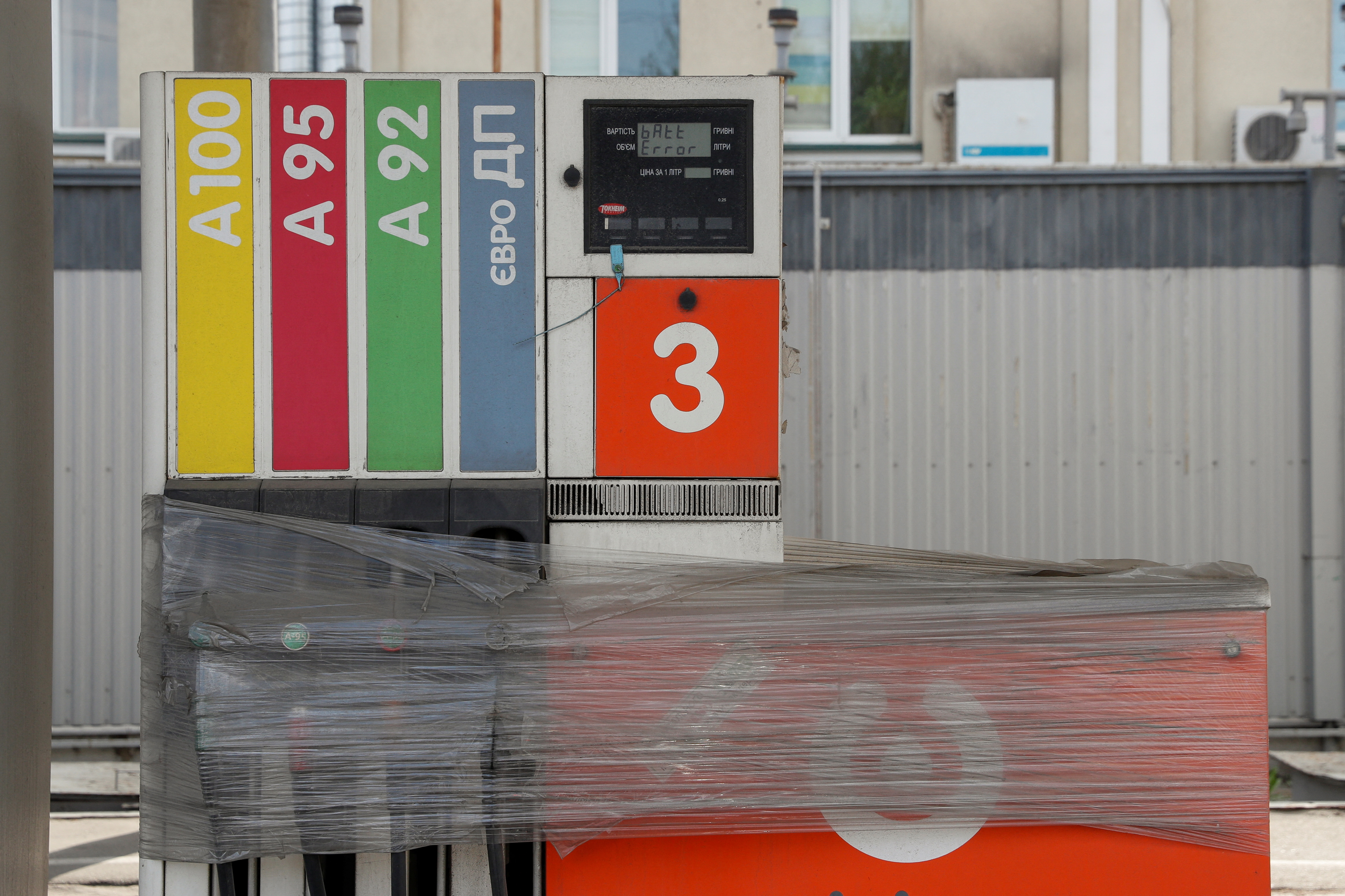 Fuel pumps wrapped with polythene are seen at a closed petrol station in Kyiv