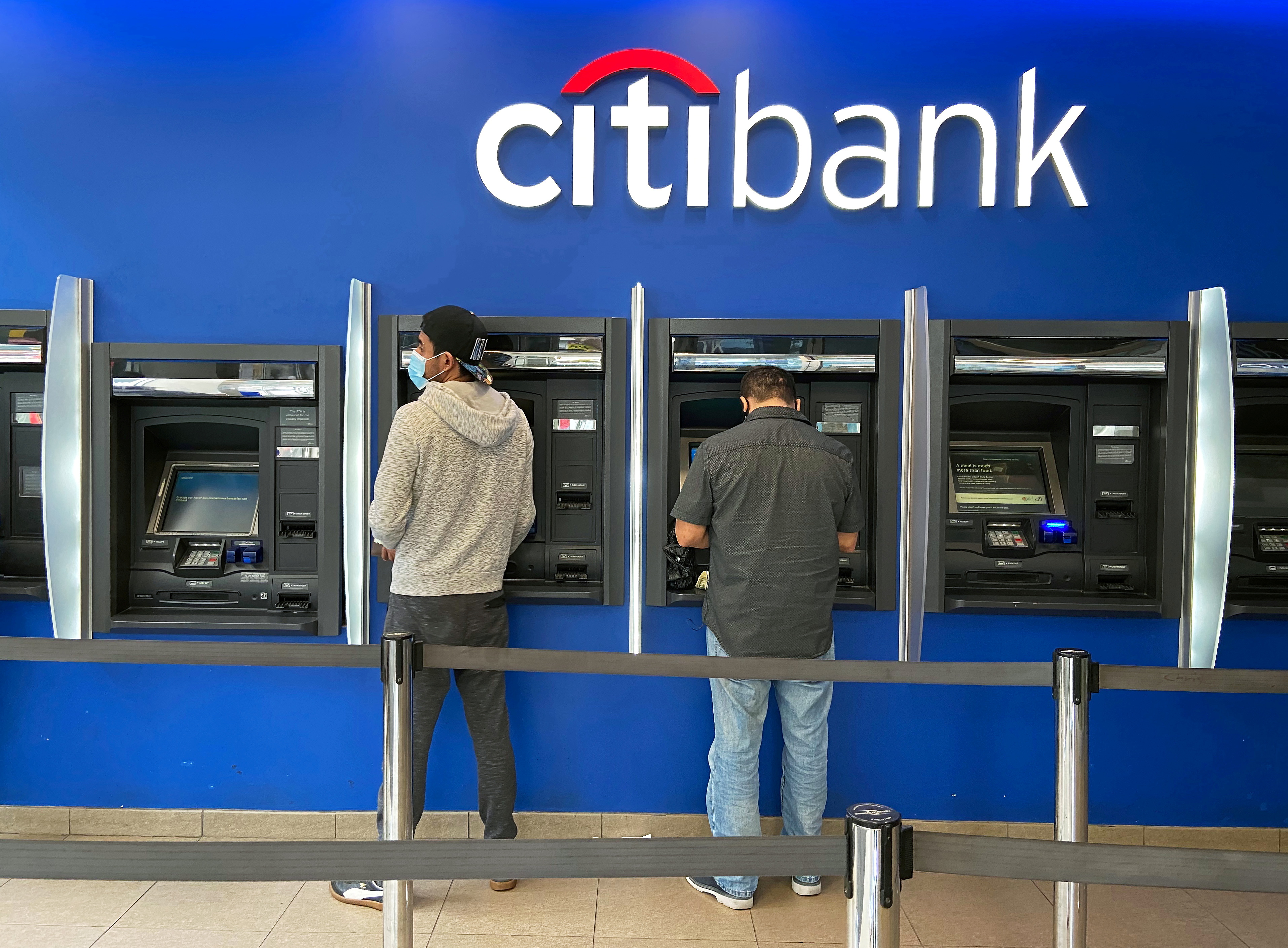 Customers use ATMs at Citibank branch in New York City