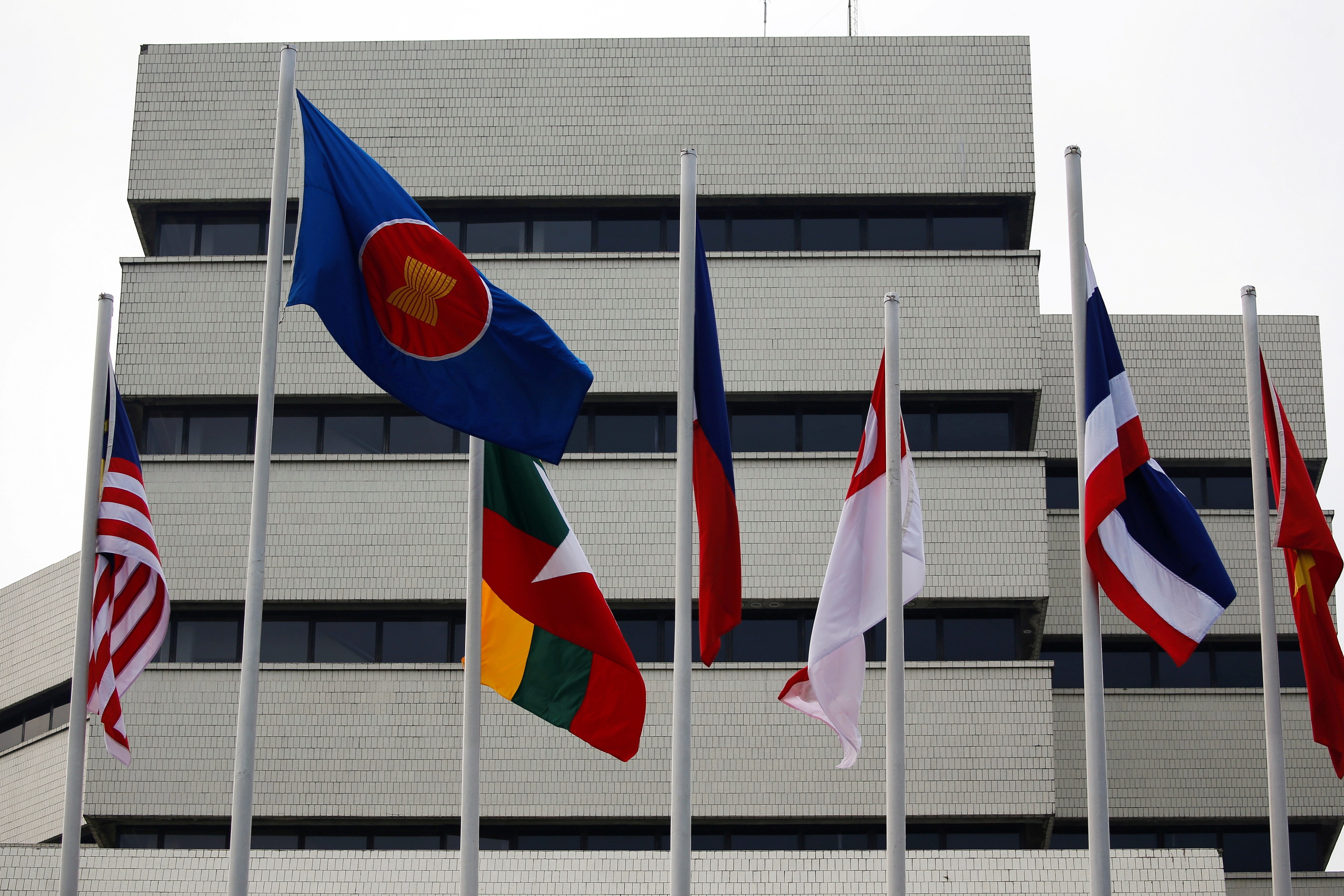 Flags are seen outside the Association of Southeast Asian Nations (ASEAN) secretariat building, ahead of the ASEAN leaders' meeting in Jakarta, Indonesia, April 23, 2021. REUTERS/Willy Kurniawan/File Photo