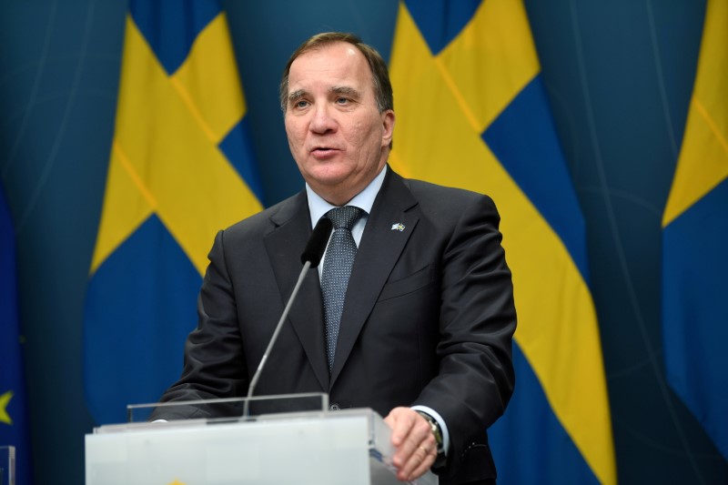 Swedish Prime Minister Stefan Lofven holds a news conference after parliament passes a bill to slow the COVID-19 pandemic