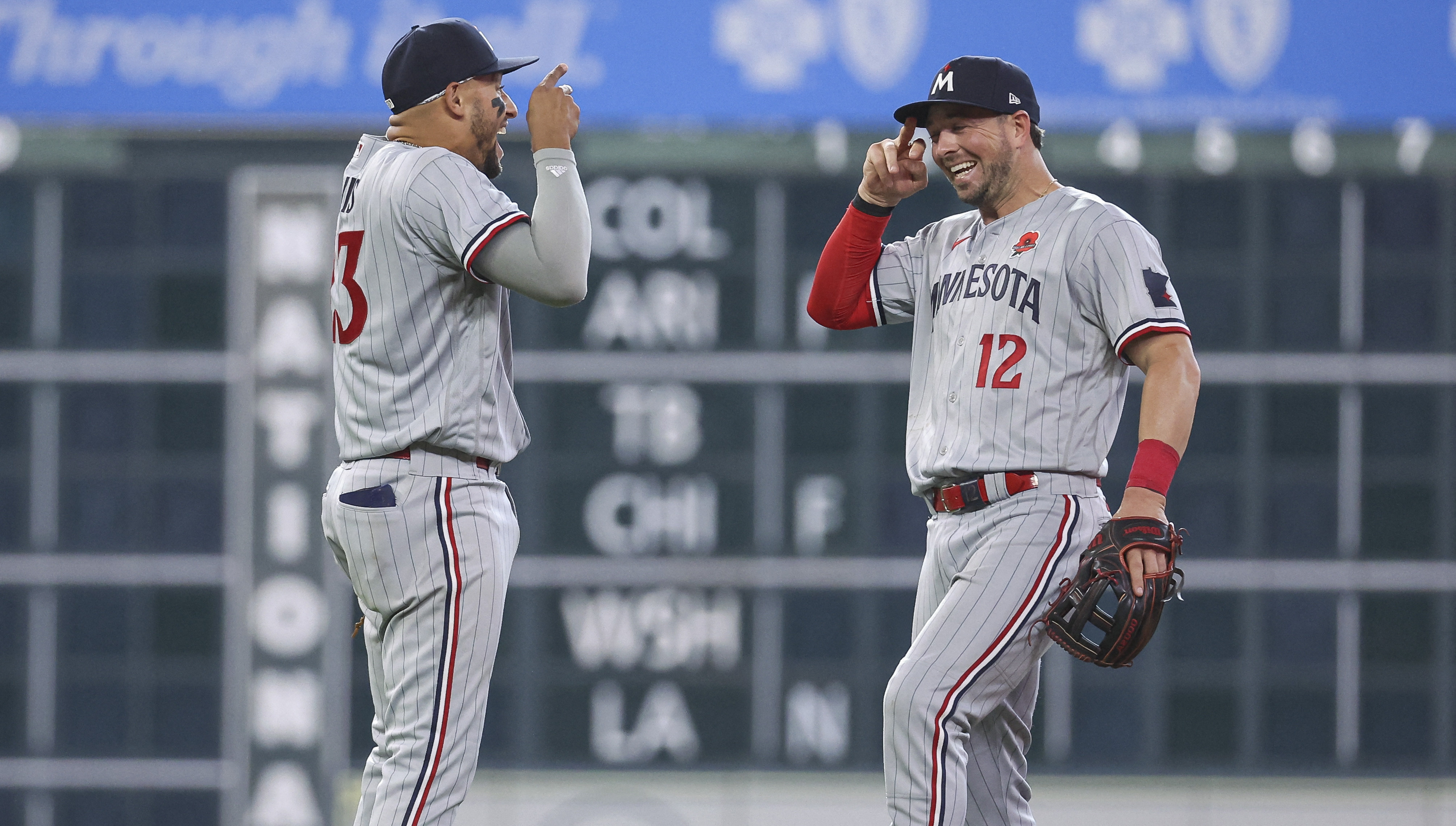 LOS ANGELES, CA - MAY 17: Minnesota Twins catcher Ryan Jeffers (27)  congratulates relief pitcher Griffin Jax (22) after their team victory in a  regular season game over the Los Angeles Dodgers