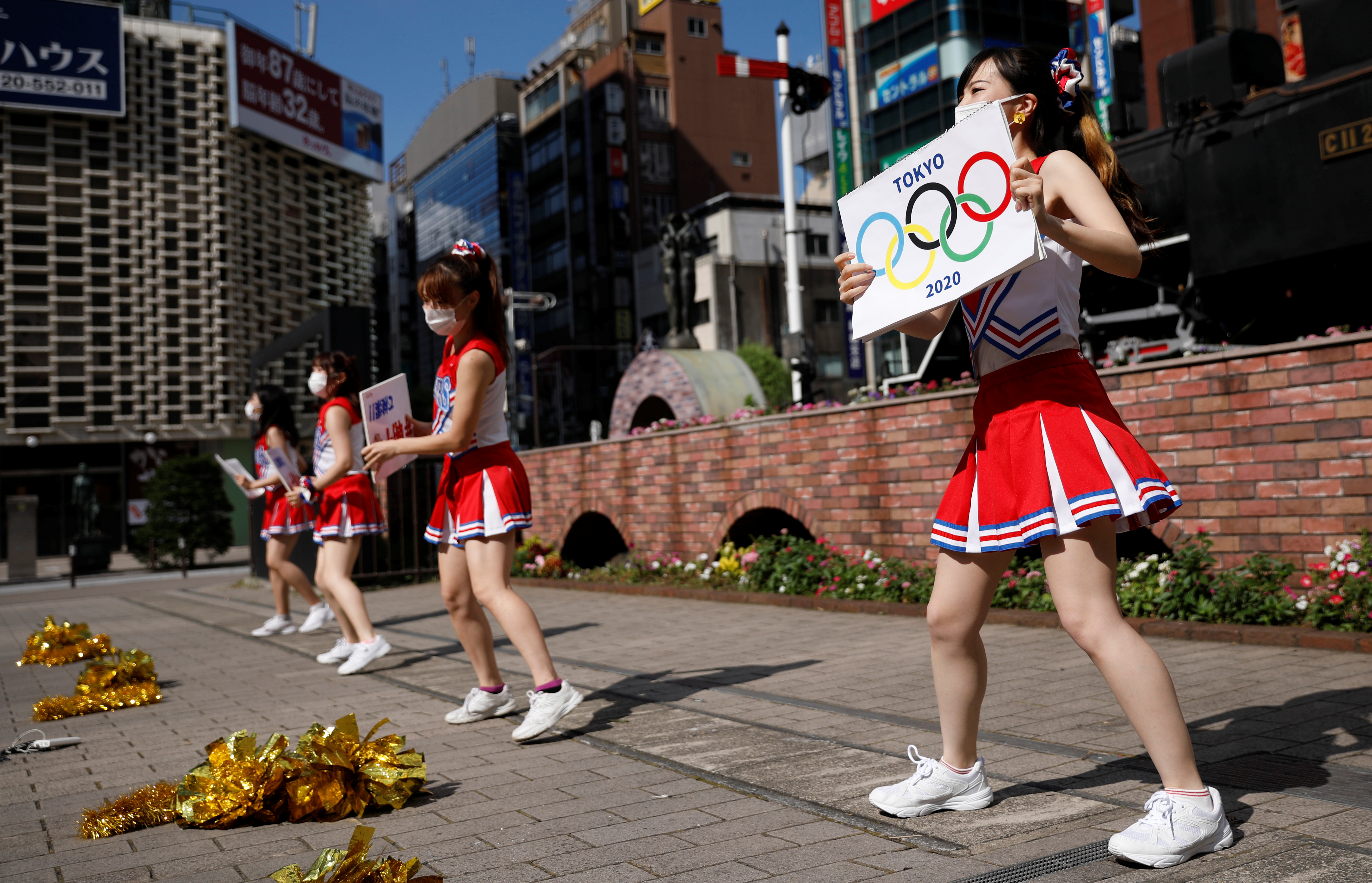 Fight!': Japan cheerleaders root for athletes as Games set to open Reuters