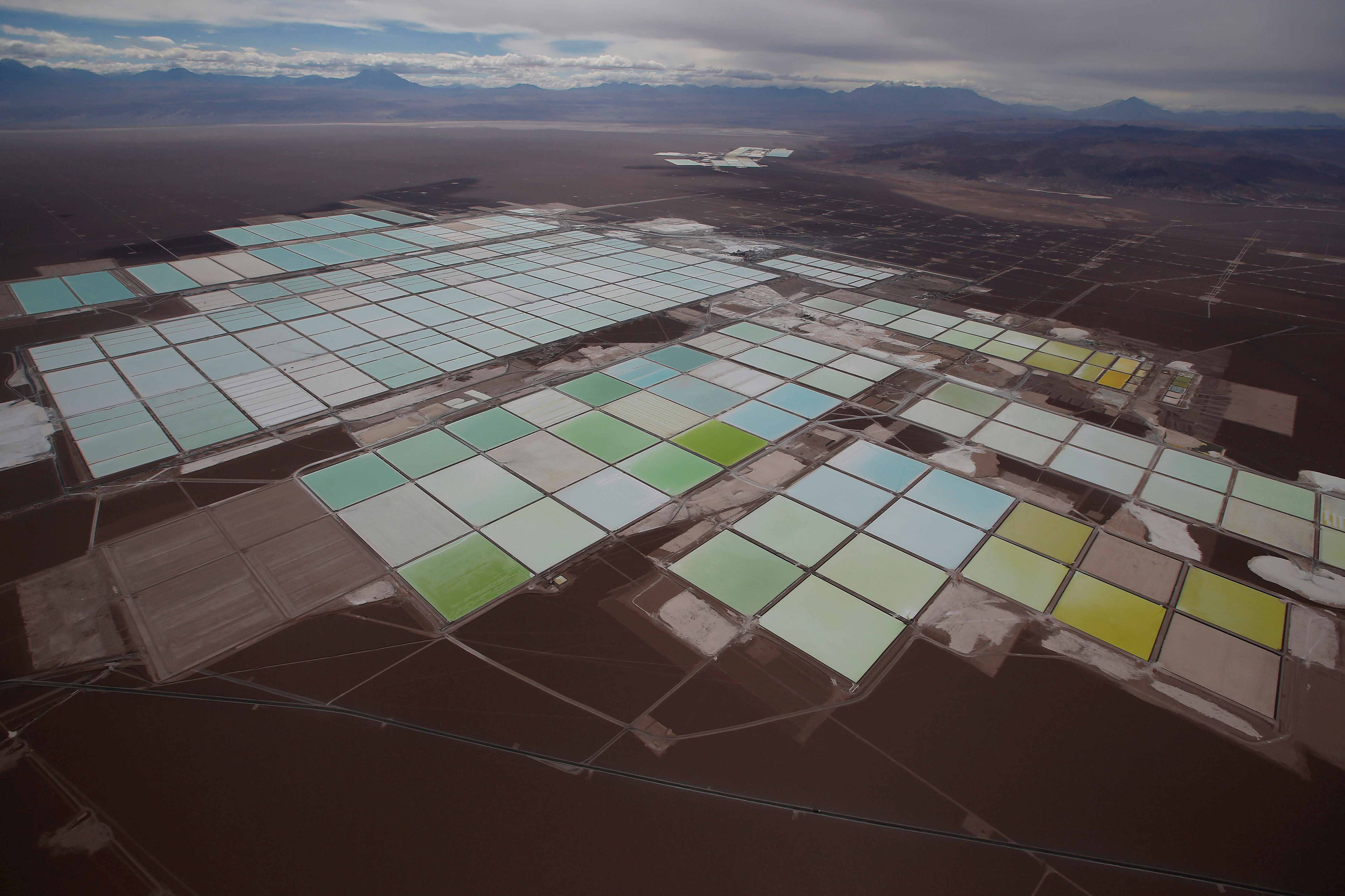 Aerial view shows the brine pools of SQM lithium mine on the Atacama salt flat in the Atacama desert of northern Chile