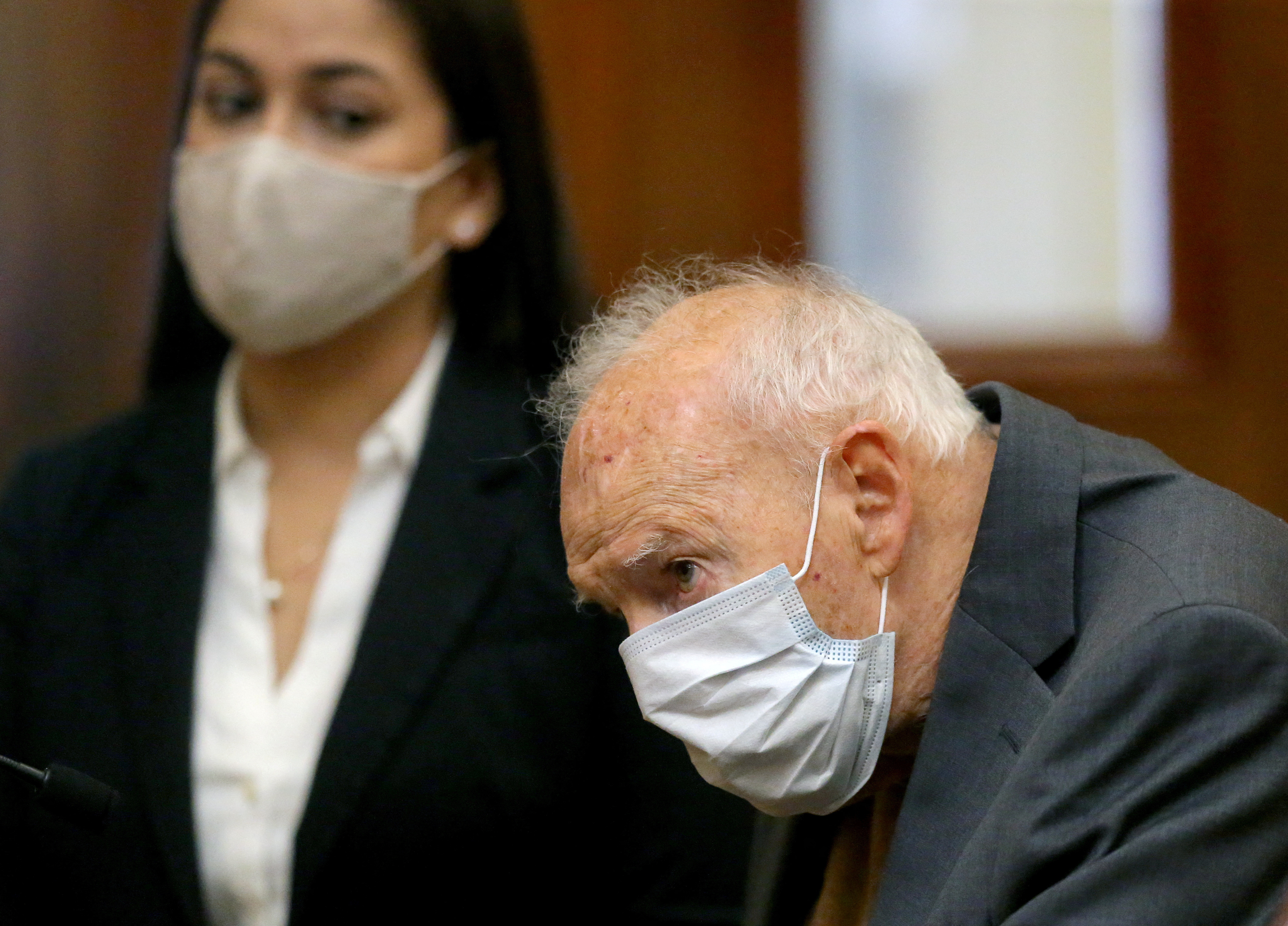 Former Roman Catholic Cardinal Theodore McCarrick wears a mask during arraignment at Dedham District Court