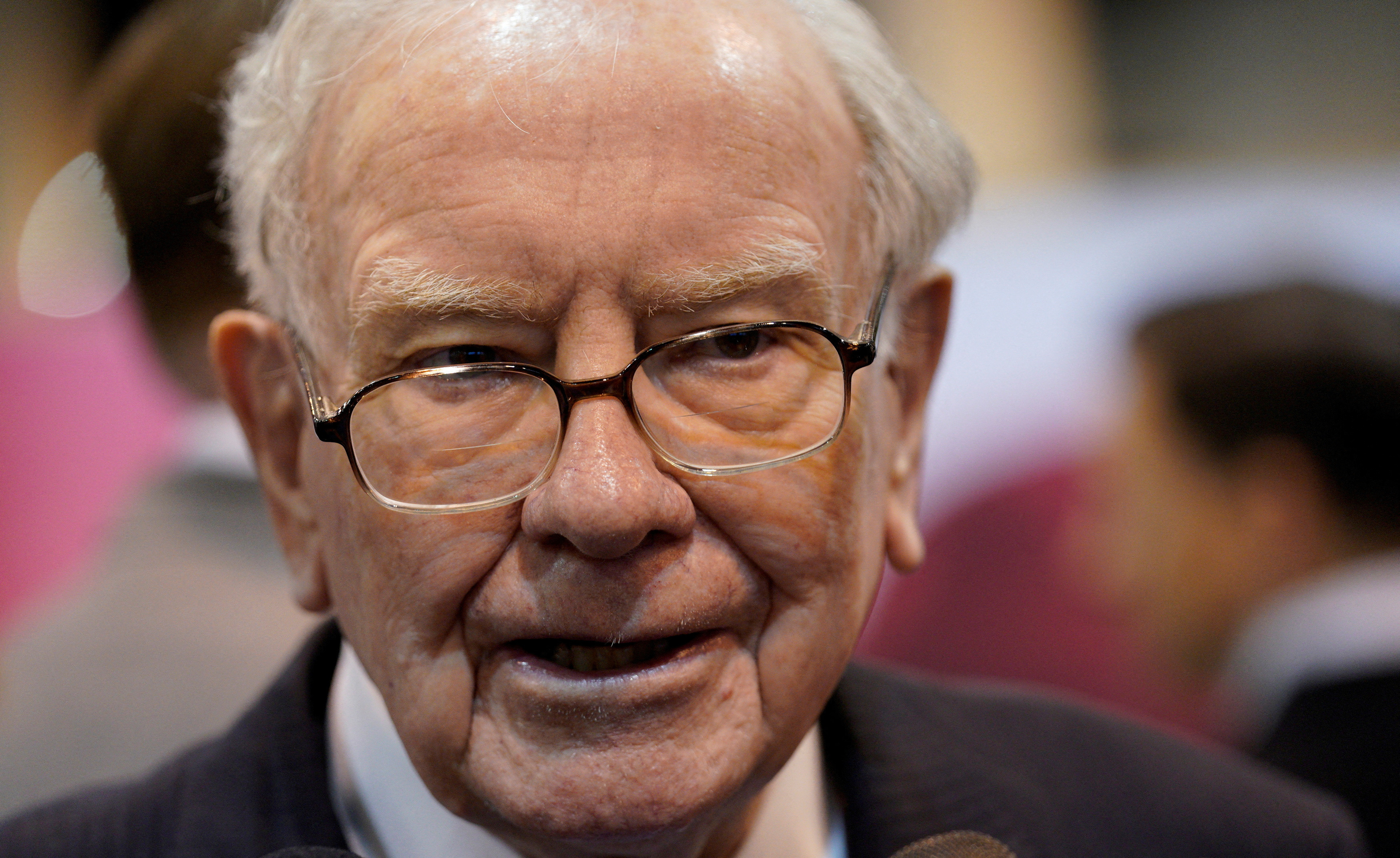 Warren Buffett, CEO of Berkshire Hathaway Inc, tours the exhibit hall at the company's annual meeting in Omaha