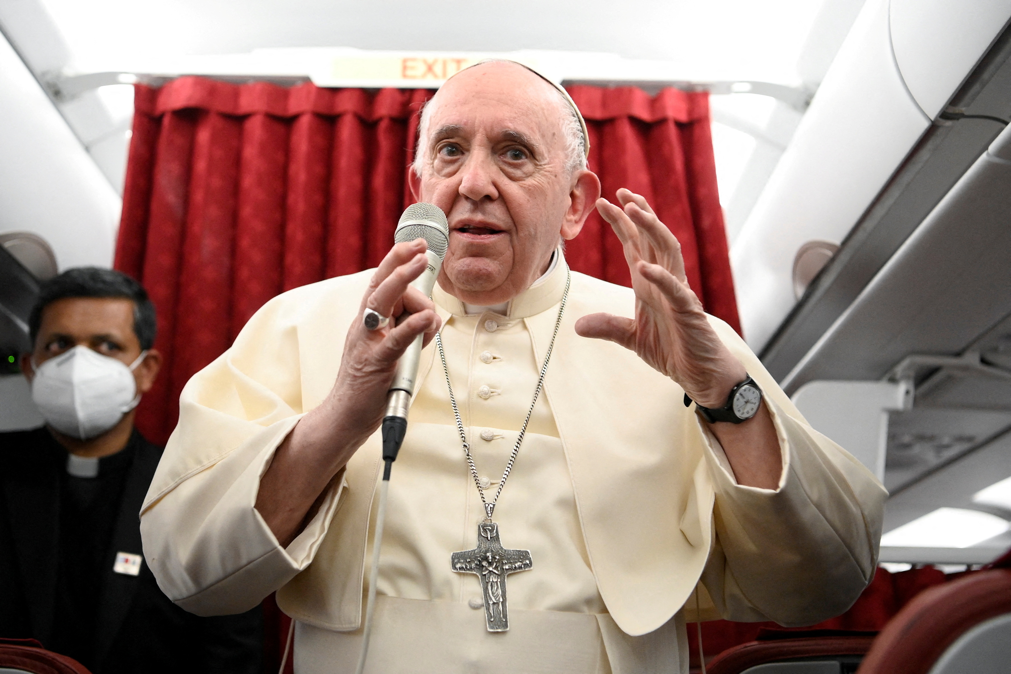 Pope Francis holds a news conference aboard the papal plane on his flight back after visiting Malta