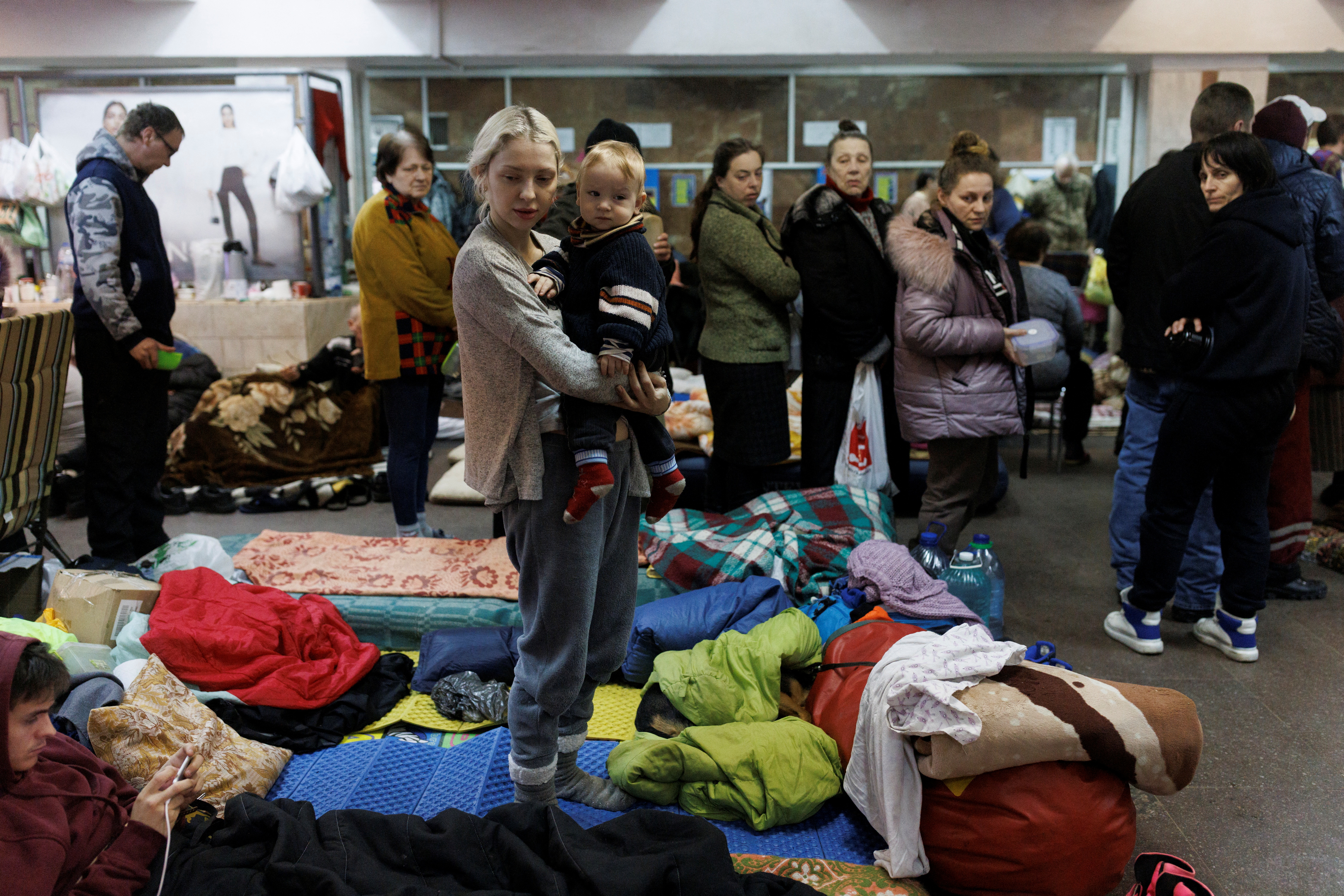 People shelter in a metro station in northern Kharkiv
