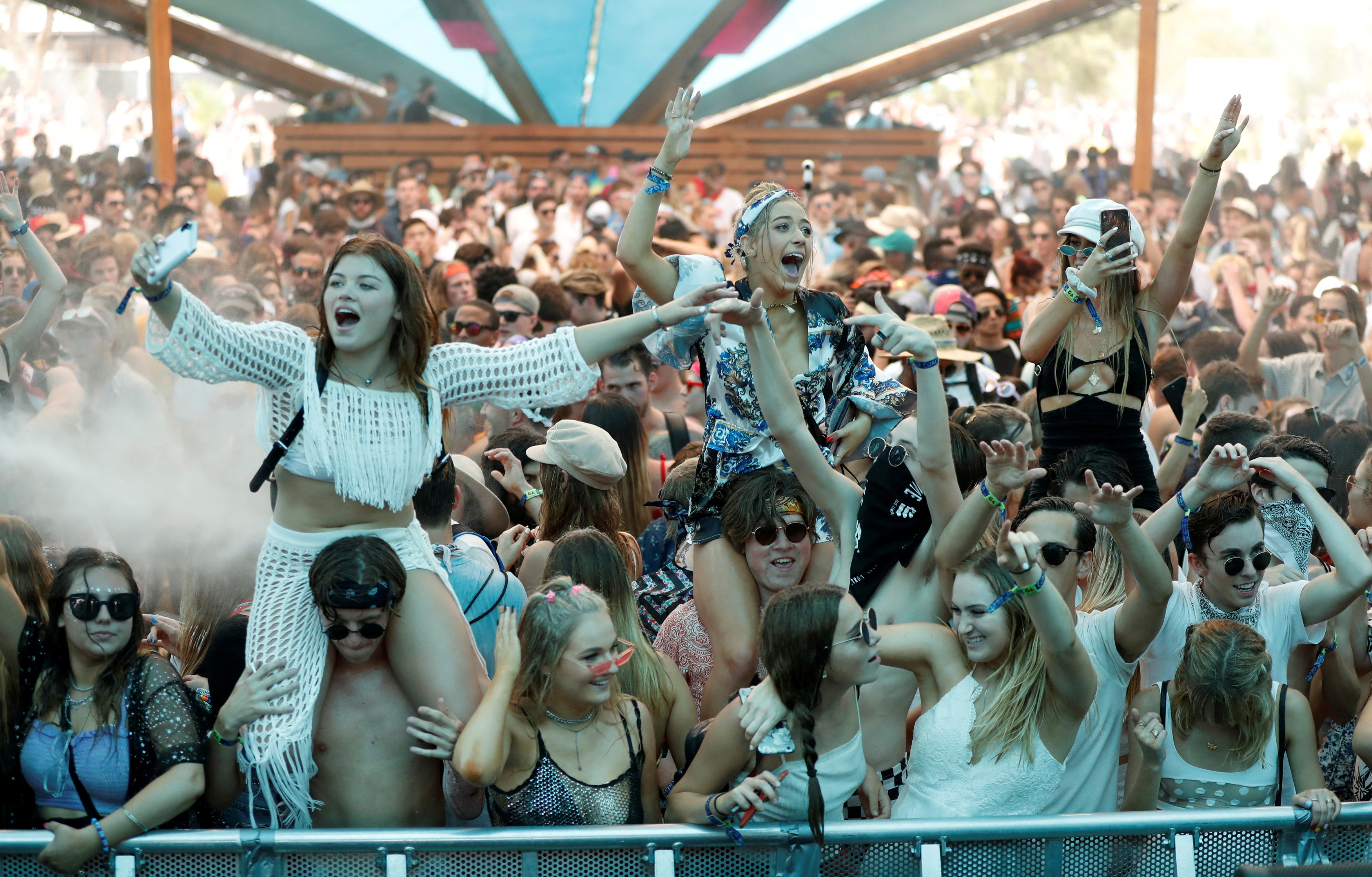 Concertgoers dance at the Do LaB stage at the Coachella Valley Music and Arts Festival in Indio