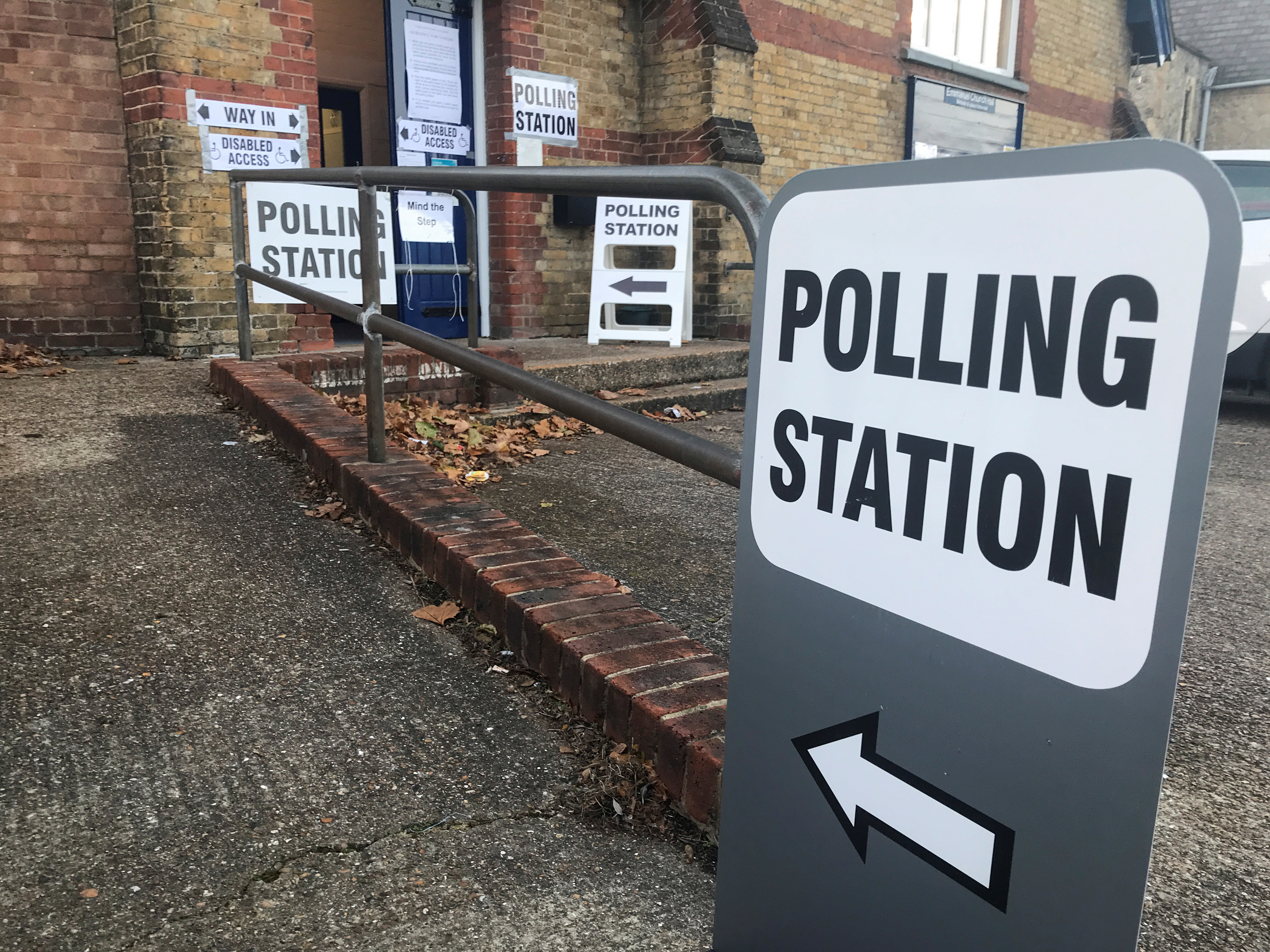 A sign stands outside a local polling station in Sidcup during parliamentary by-election in the London Borough of Bexley, Britain December 2, 2021. REUTERS/Victor Jack  