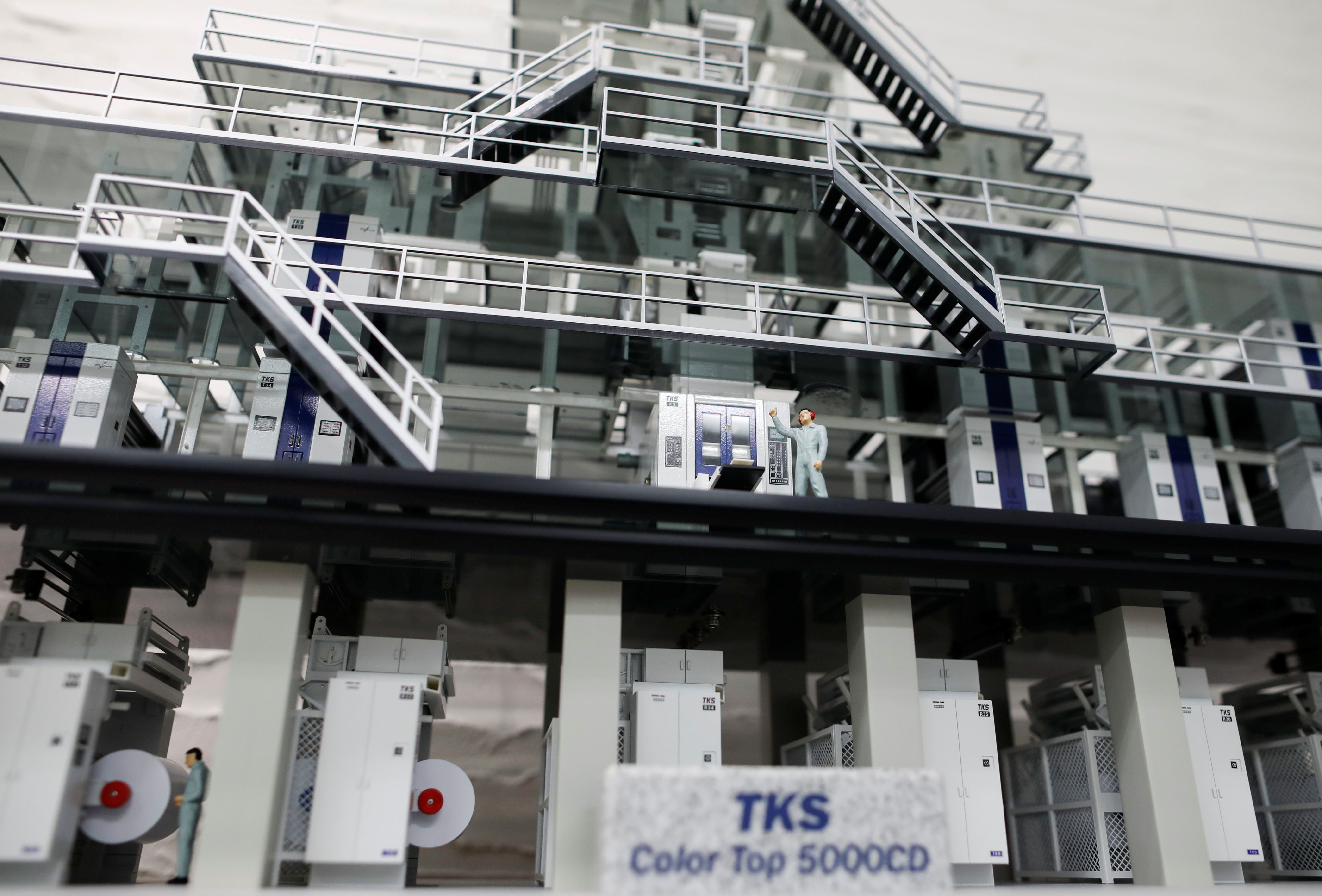 A miniature model of Tokyo Kikai Seisakusho Ltd.'s Color Top 5000CD newspaper rotary press is displayed at the company headquarters office in Tokyo, Japan October 21, 2021. REUTERS/Issei Kato