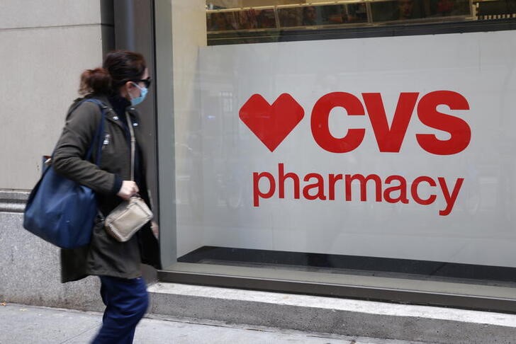 A person walks by a CVS pharmacy store in Manhattan, New York