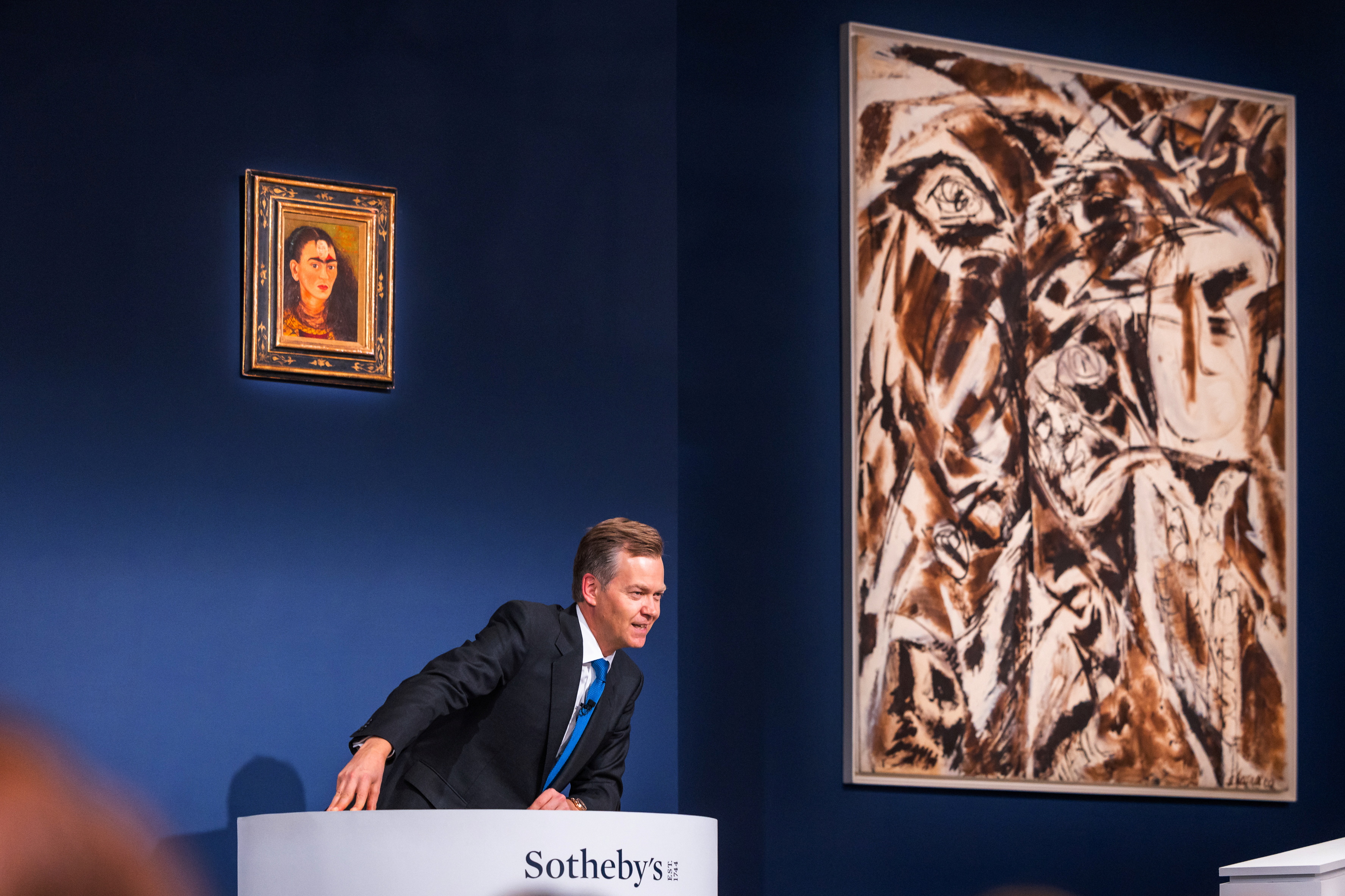 Auctioneer Oliver Barker, Chairman of Sotheby's Europe, sells a Frida Kahlo self portrait for $34.9 Million USD during an art auction, in the Manhattan borough of New York City, New York, U.S., November 16, 2021.  Julian Cassady/SOTHEBY'S/Handout via REUTERS   