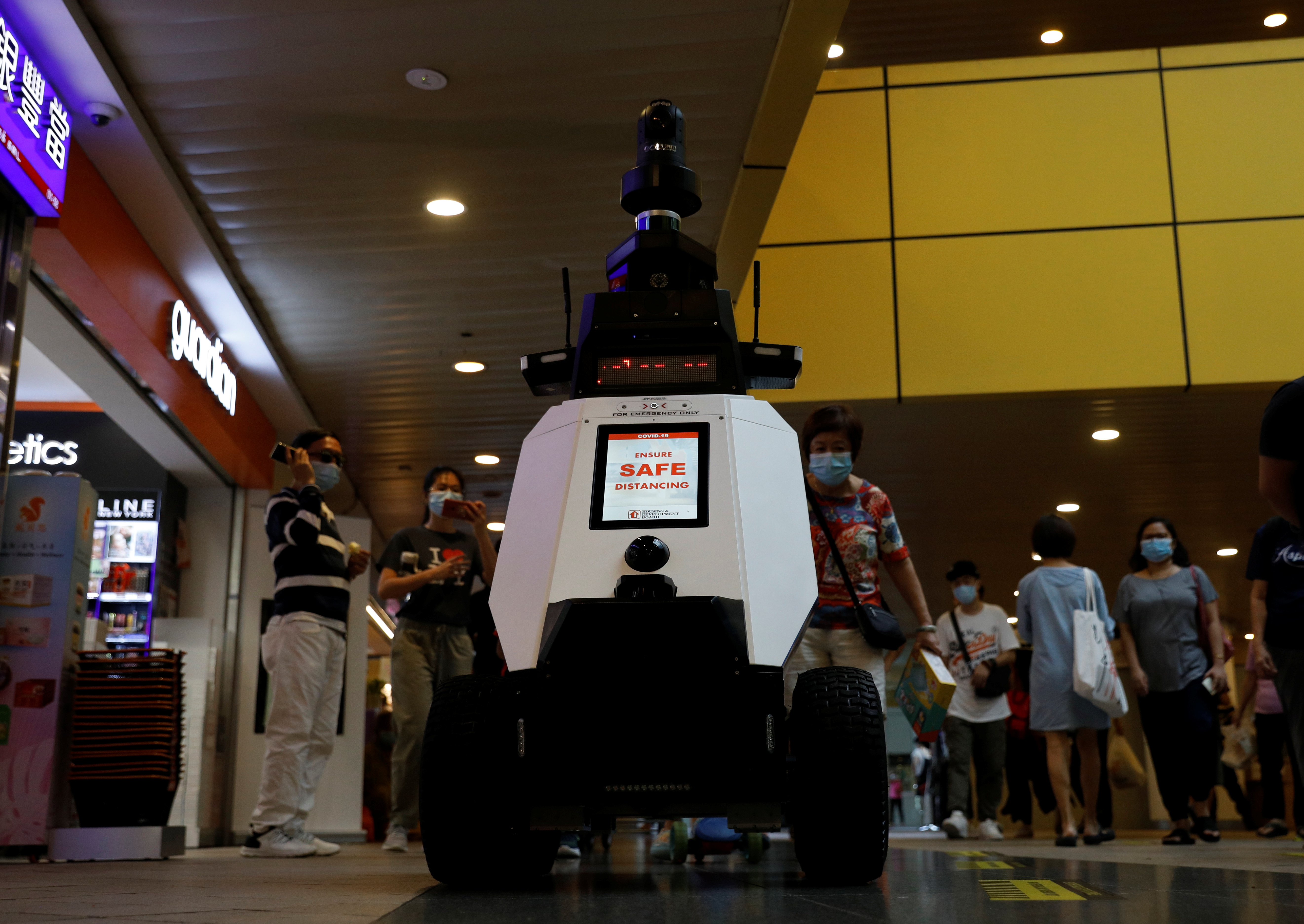 Autonomous robot Xavier patrols a neighbourhood mall to detect "undesirable social behaviours", such as the flouting of COVID-19 safety measures, smoking in prohibited areas and improperly parked bicycles, during a three-week trial in Singapore September 6, 2021. REUTERS/Edgar Su