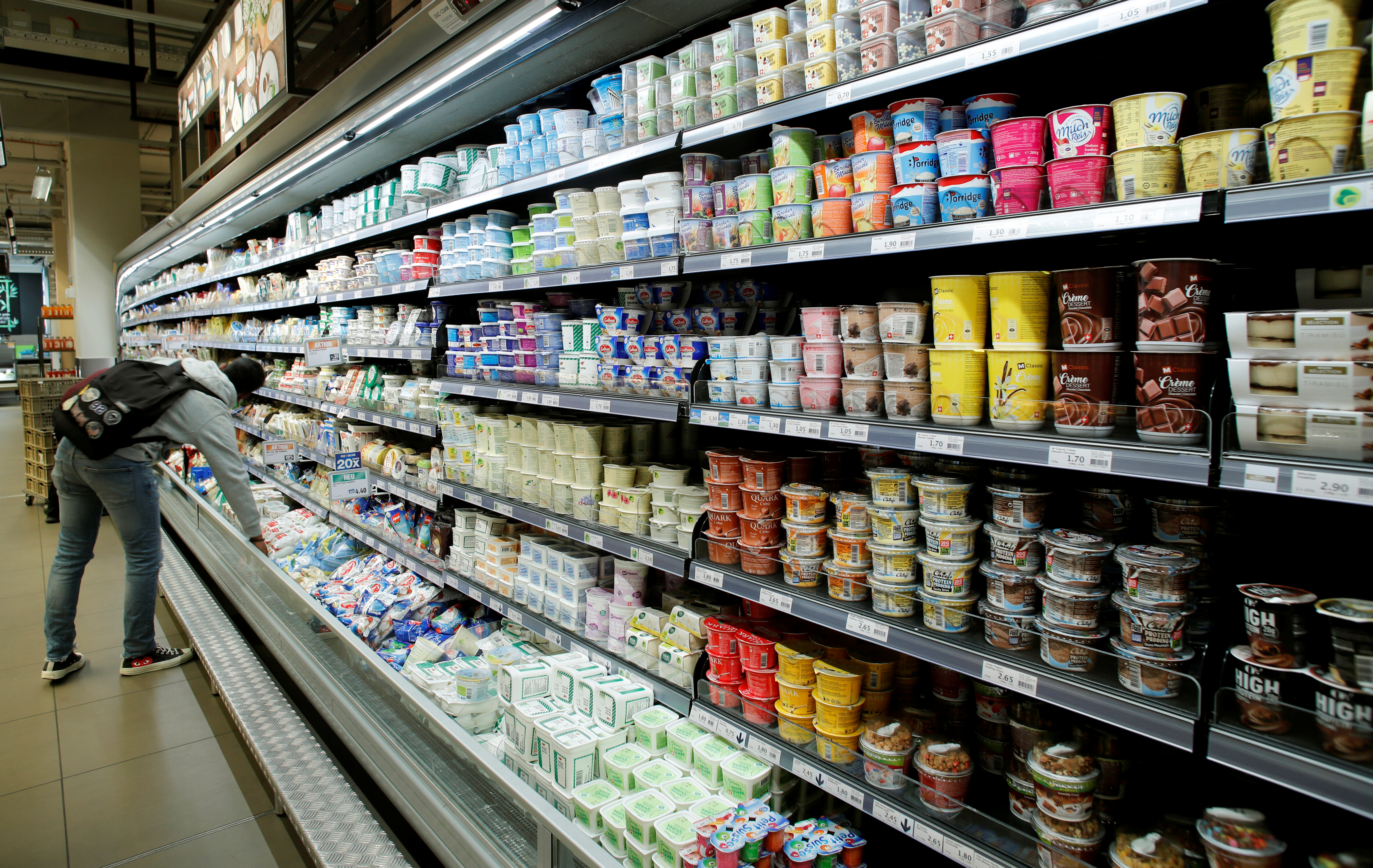 Various products are displayed on a refrigerated shelf at a supermarket of Swiss retail group Migros in Zurich