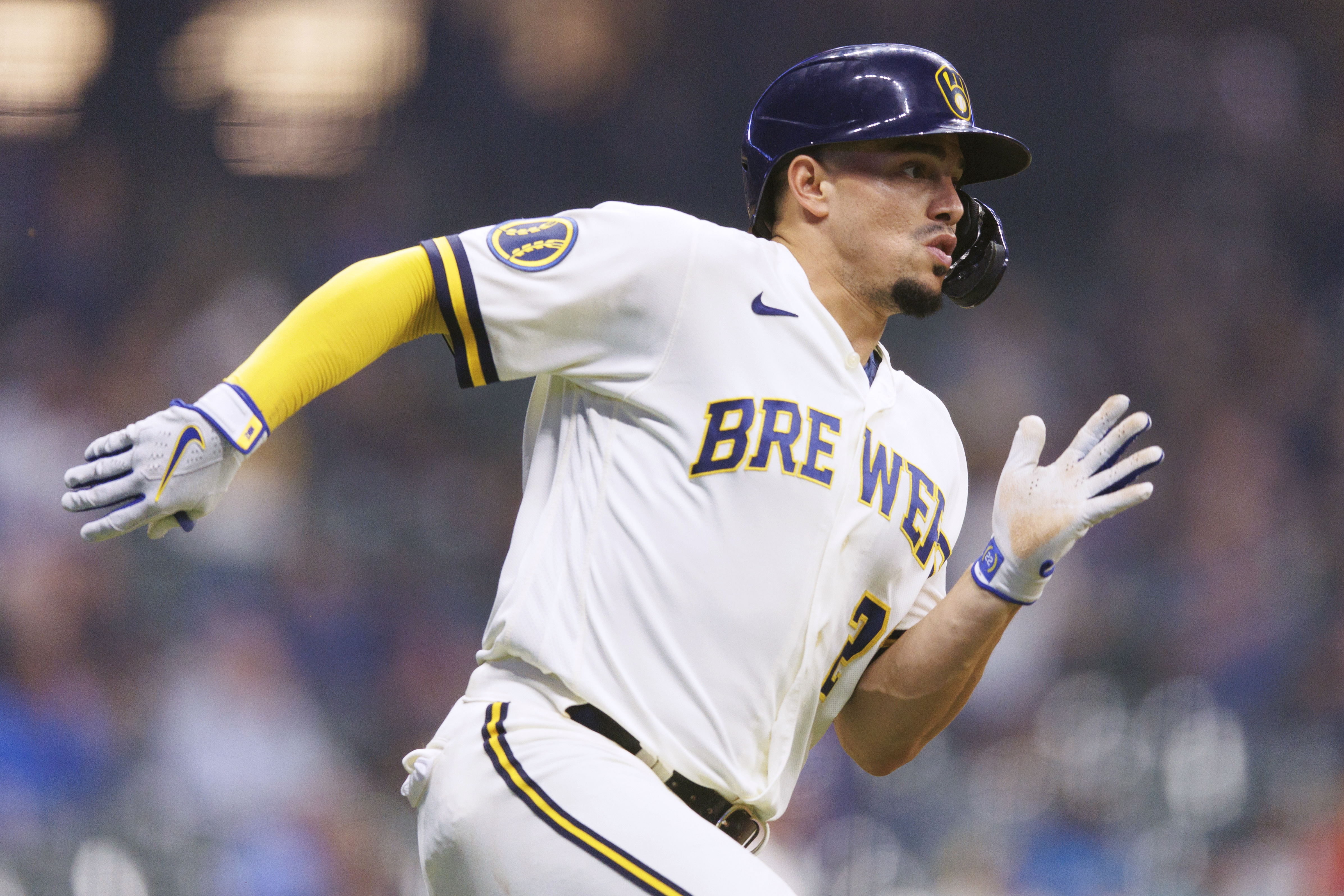 Marlins lose opener to Brewers, narrowly avoid shutout