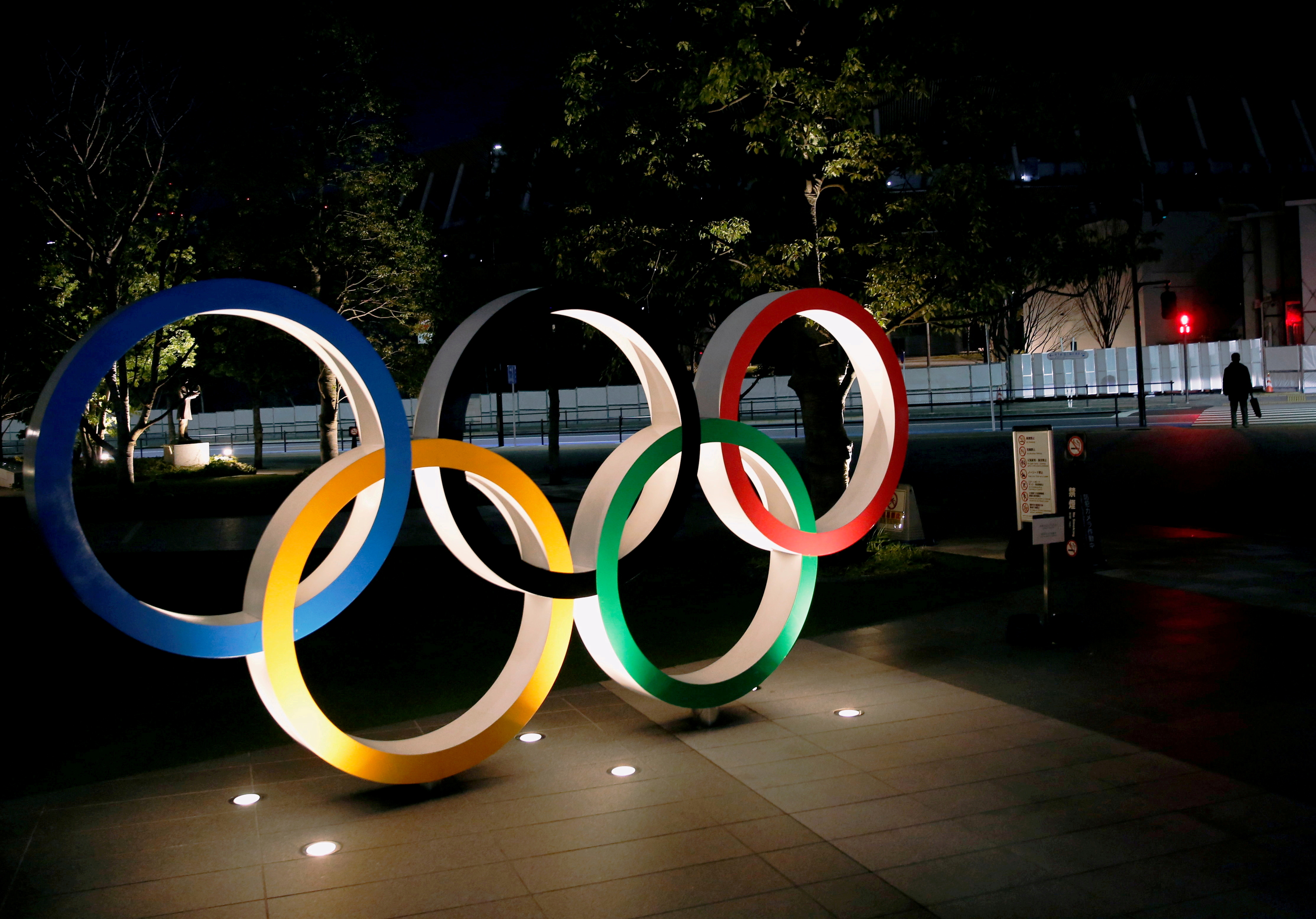 Olympic rings are seen near the National Stadium in Tokyo