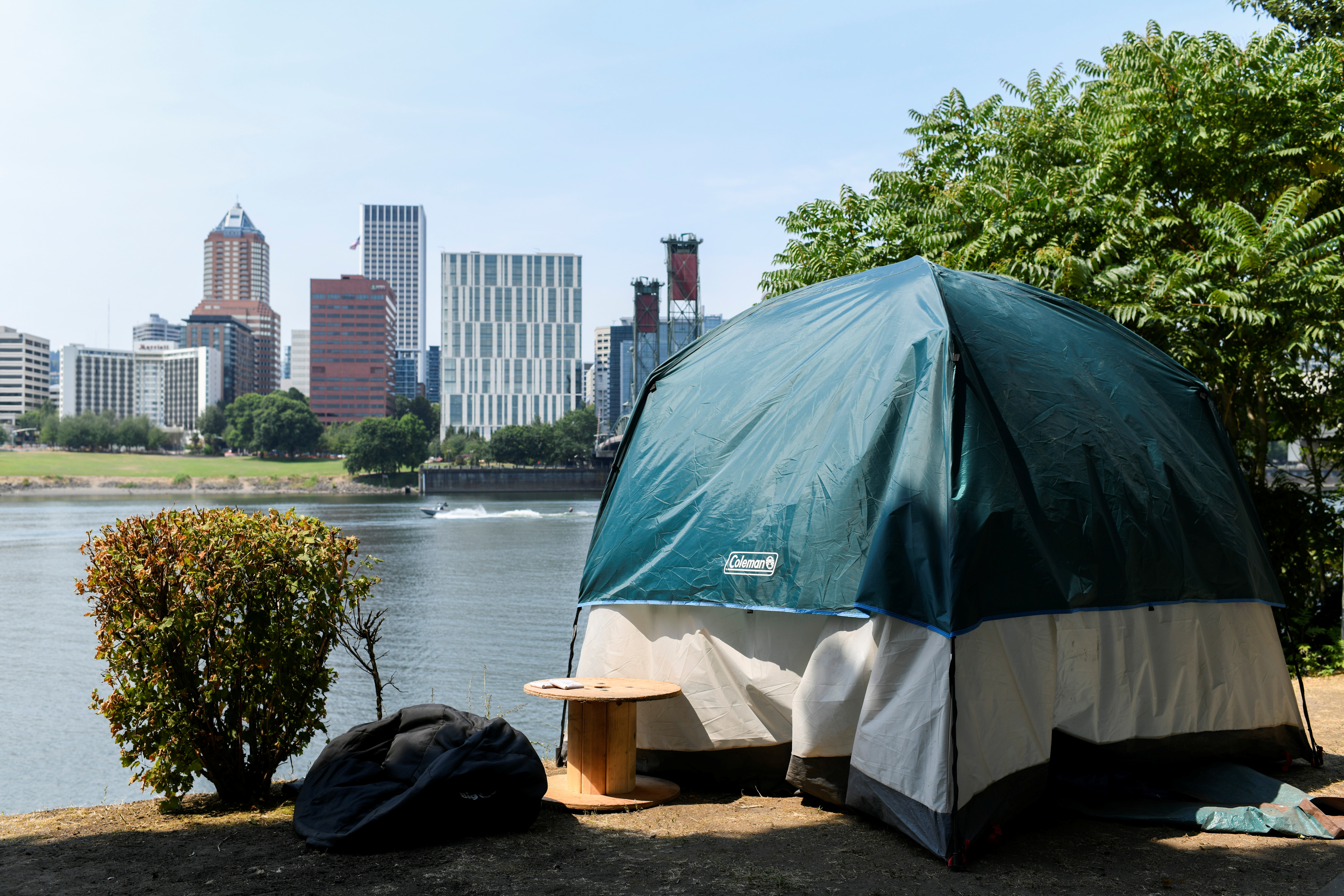A tent sits across the Willamette River from downtown as a heat wave continues in Portland, Oregon, U.S., August 12, 2021. REUTERS/Mathieu Lewis-Rolland